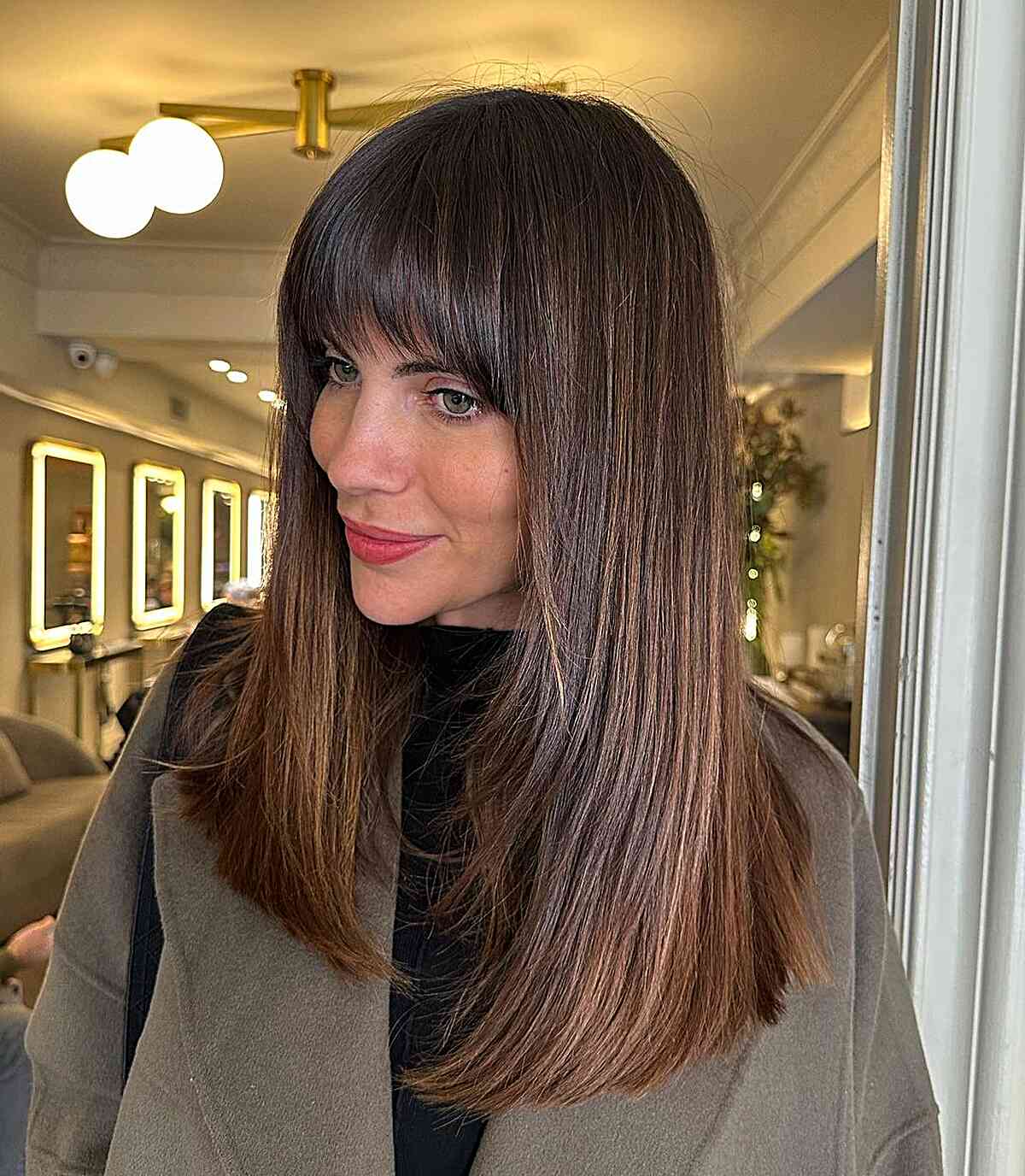 Sleek Chestnut Brown Hair with Elegant Arched Bangs for ladies with medium to long hair