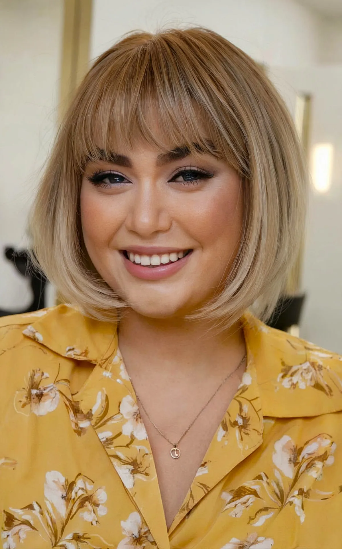 Chin-Length Sleek French Bob with Feathered Bangs for round-shaped faces