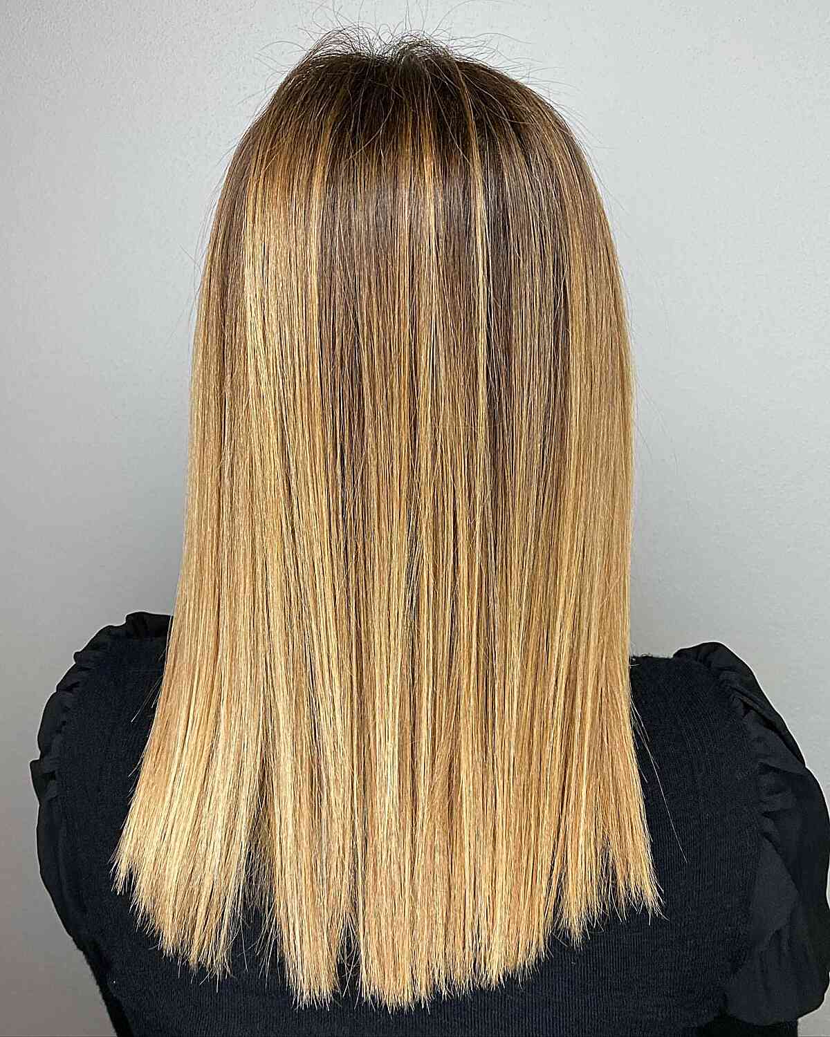 Sleek Gold Blonde with Dark Roots