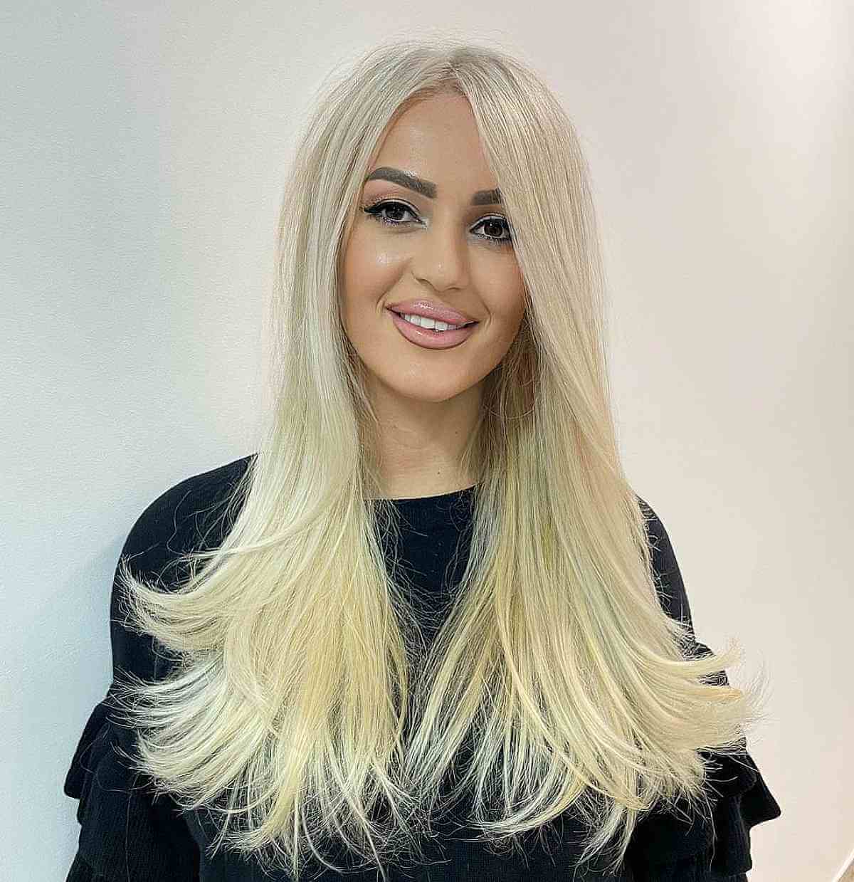 Sleek Long Hairstyle with Curved Ends for Thick Hair