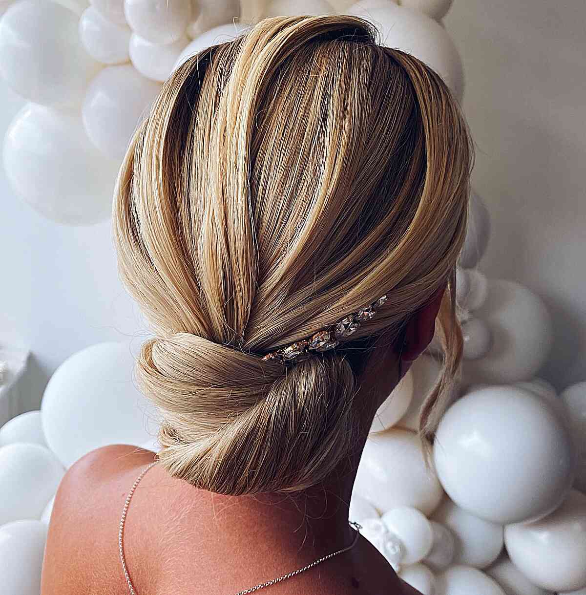 Sleek low chignon hairstyle for wedding