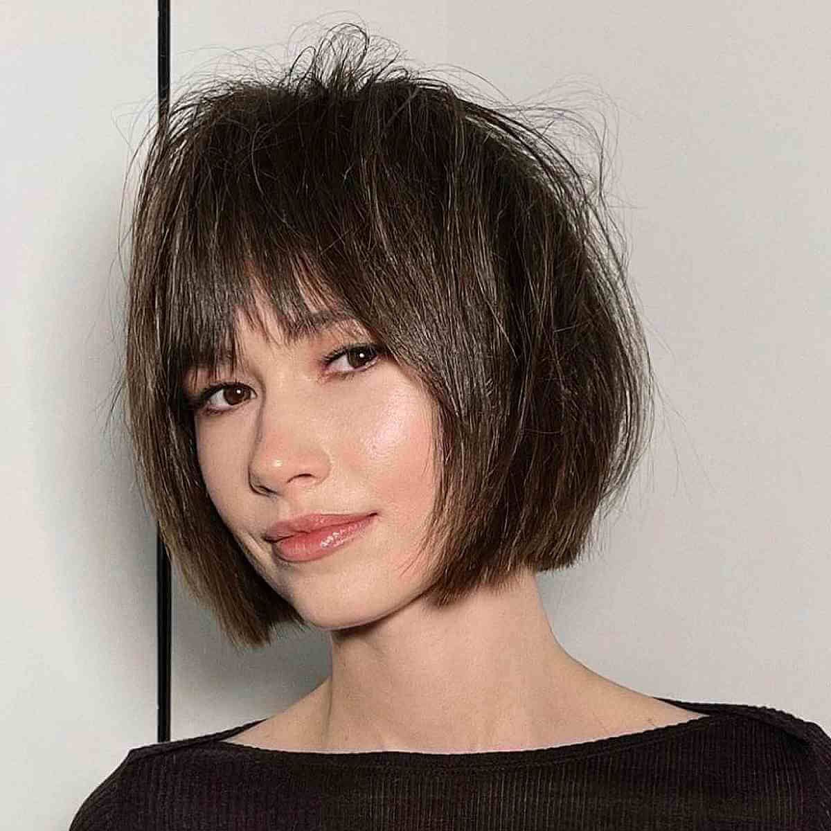 Jaw-Length Sleek Messy Bob with Textured Bangs