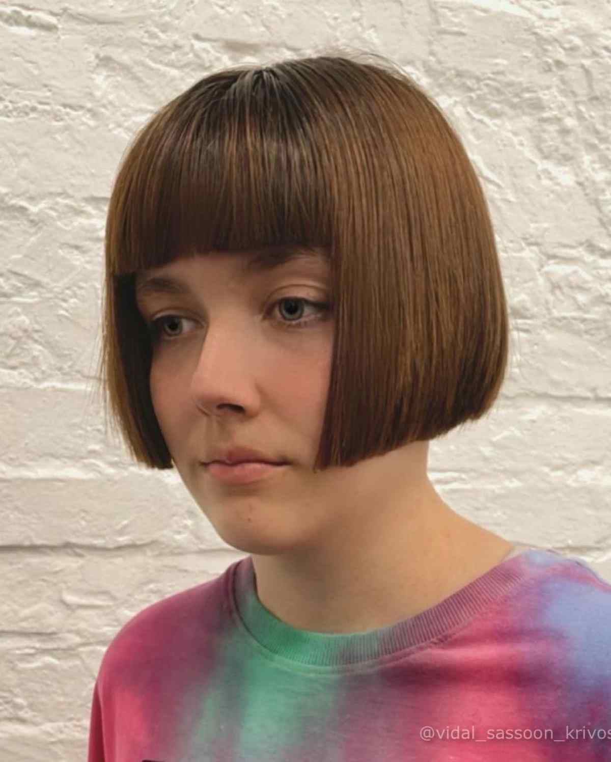 Sleek Micro Bob with Straight Bangs Cut at Ear-Length