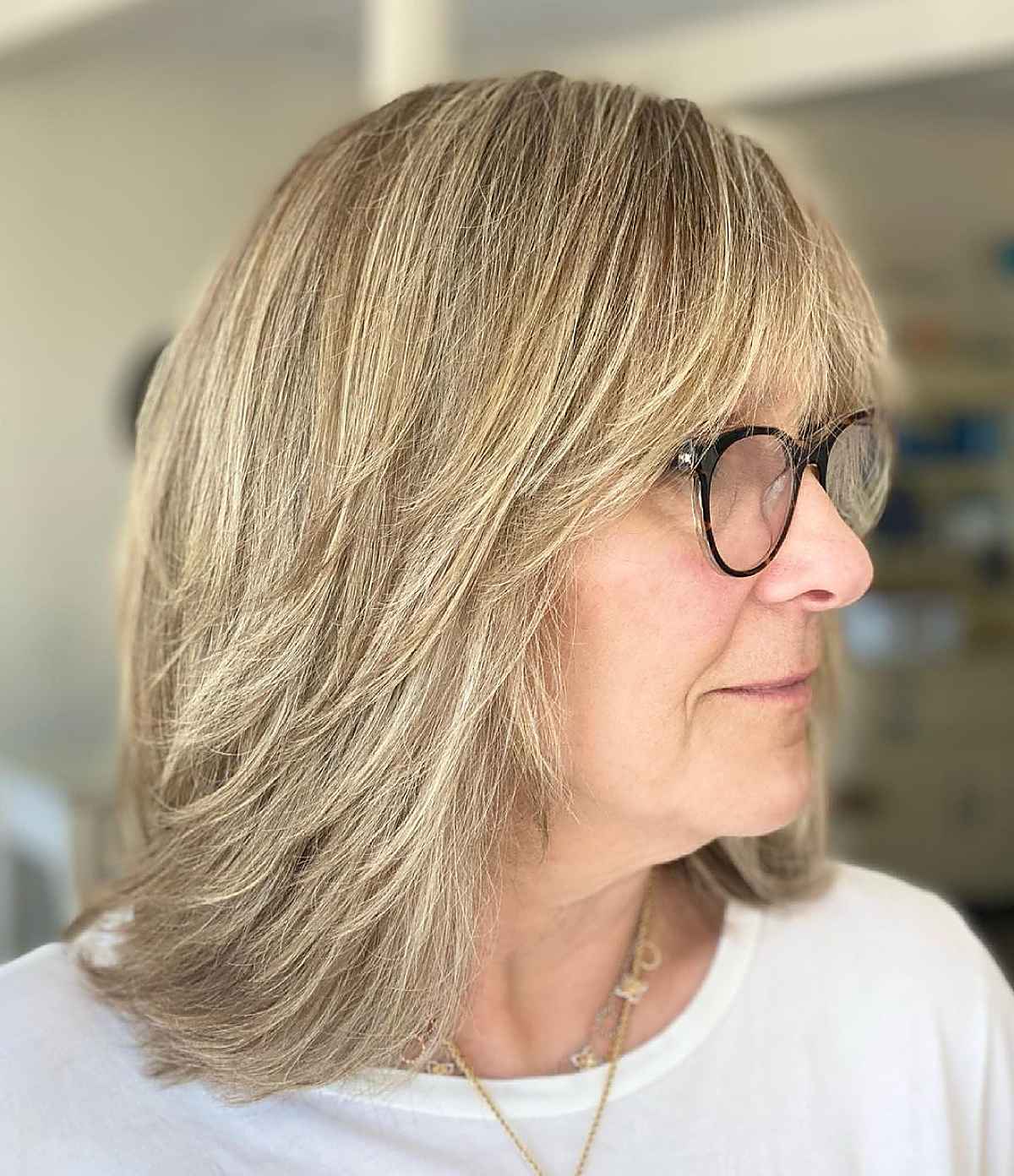 Sleek Shaggy Layers with Bangs for Women Over 60