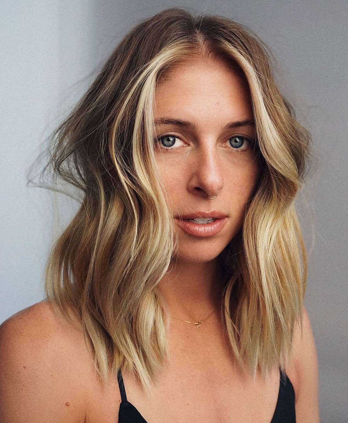 sleek shoulder-length blunt layers for wavy hair