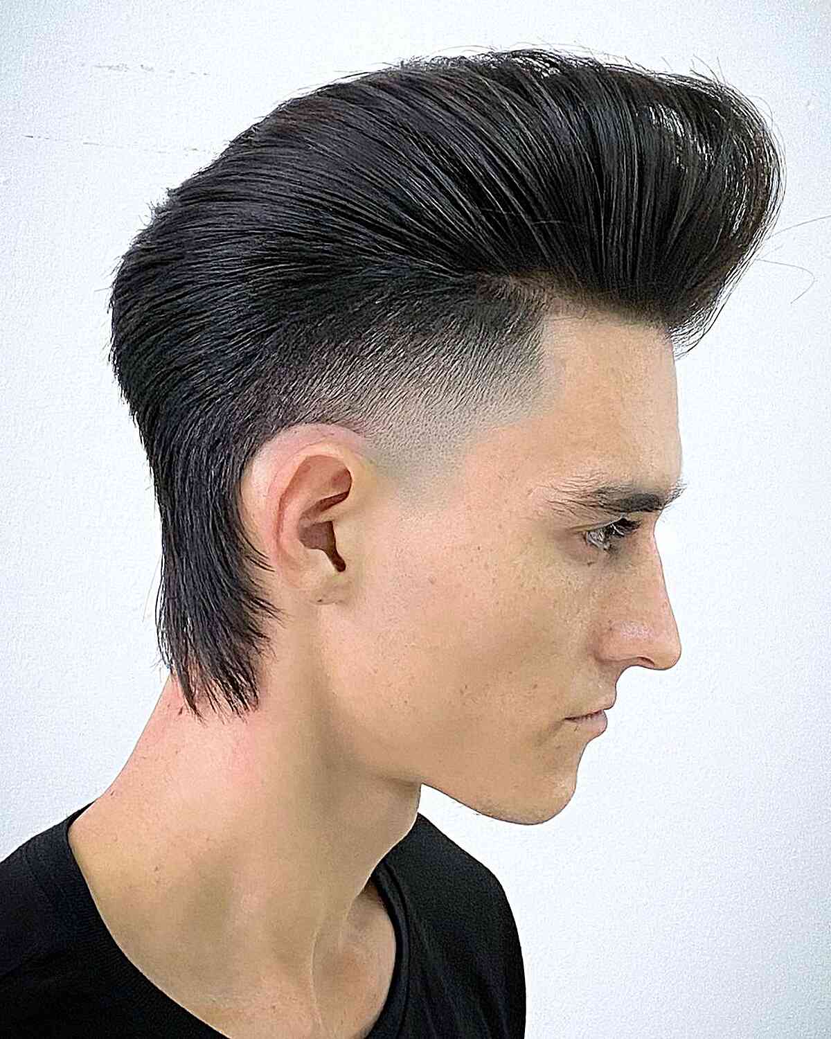 Sleek Voluminous Pomp with Shaved Sides and Longer Hair at Nape Area