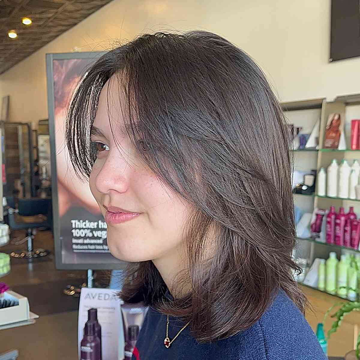 Sleek Wispy Layers on Medium-Length Chestnut Bobbed Hair