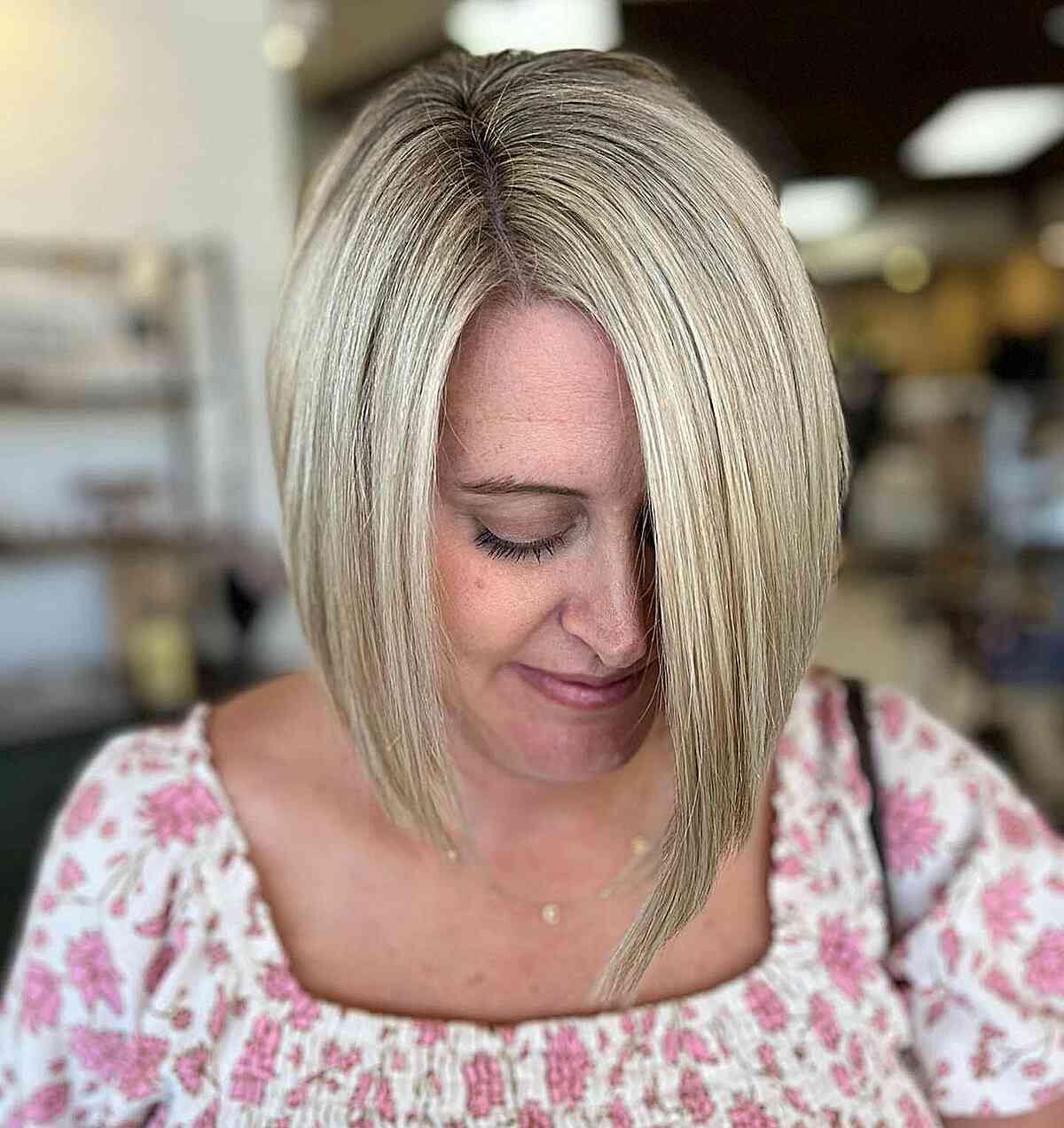 Soft Ash Blonde on Side-Parted Asymmetrical Bob with Straight Angled Layers