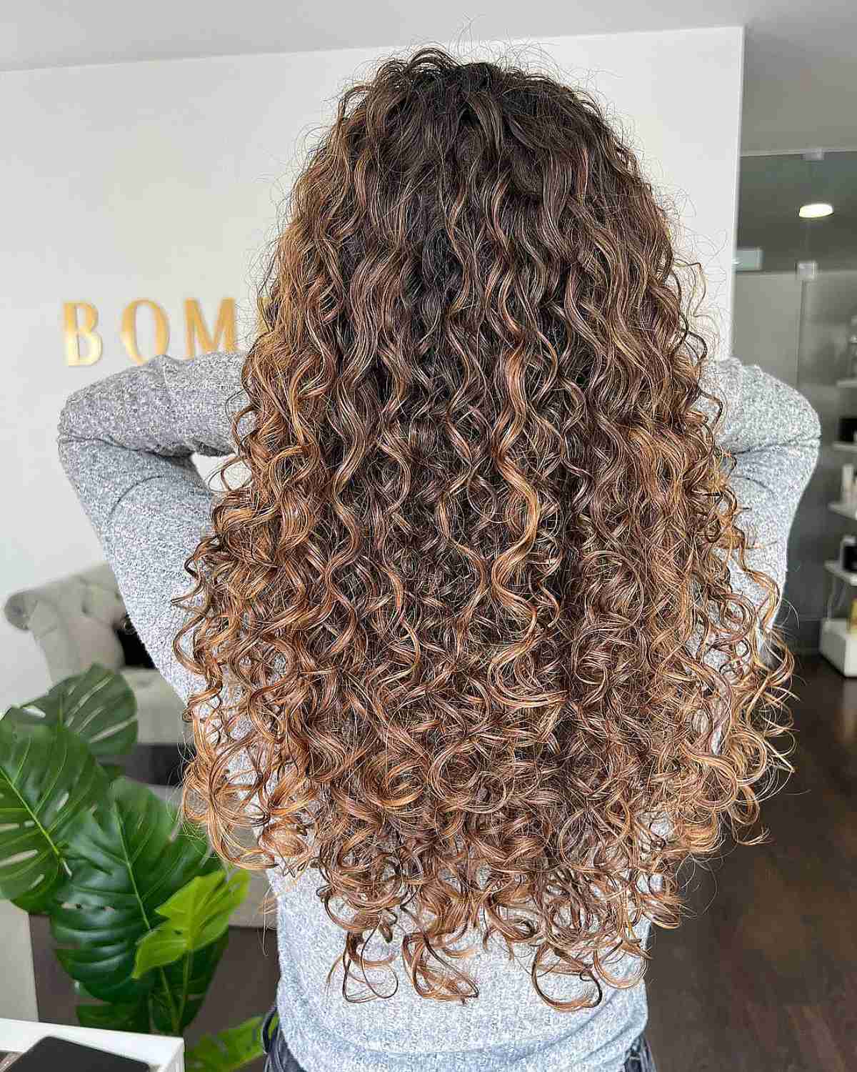 Soft Auburn Hues on Curly Balayage Hair