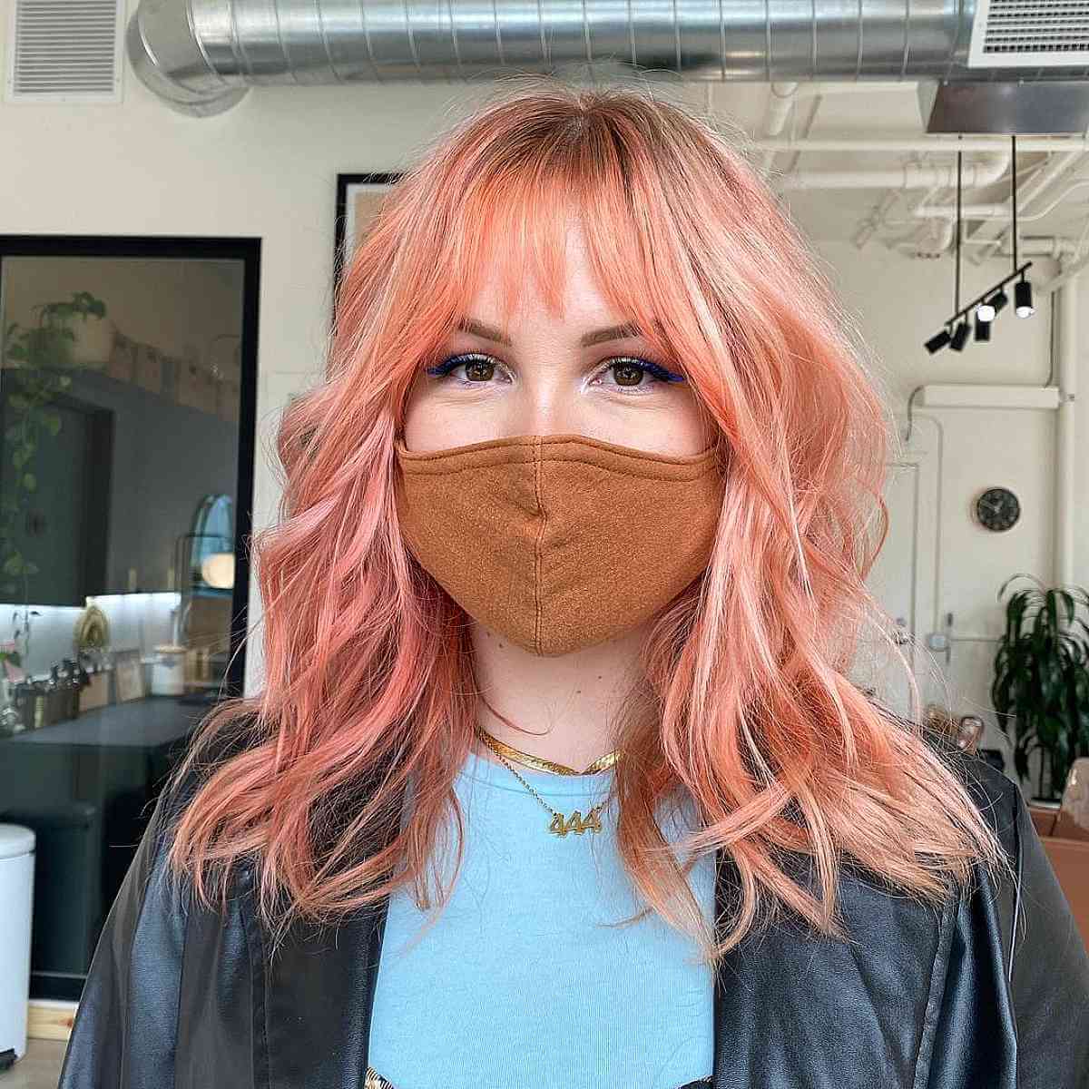 Soft Bangs for Mid-Length Layered Hairstyles