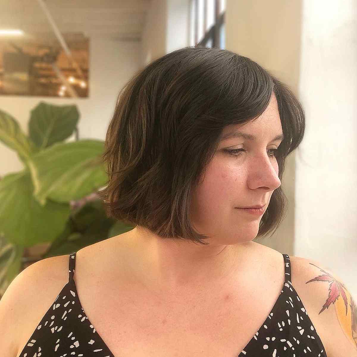 Soft Chin-Length Bob with Curtain Bangs for a Chubby Face