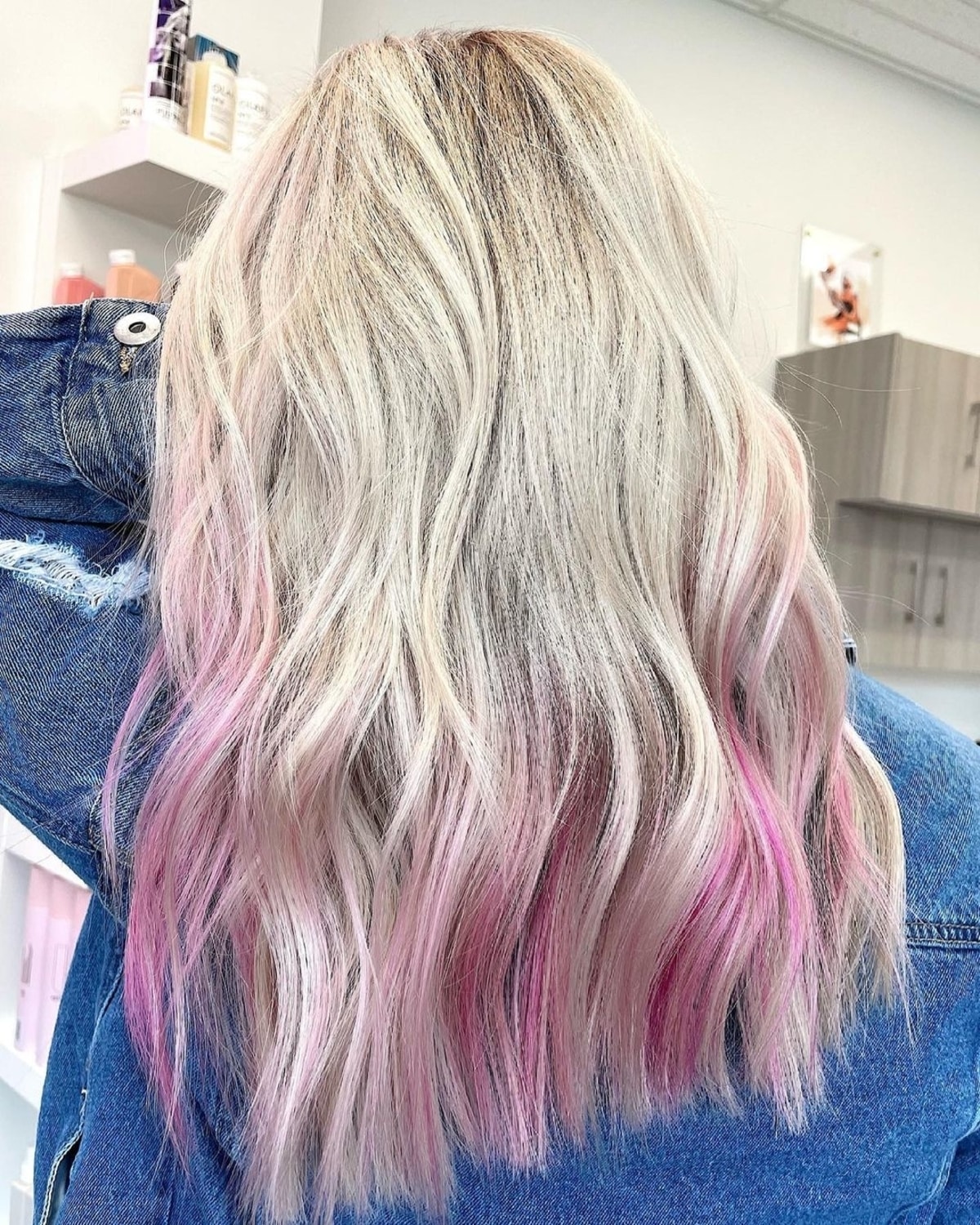 Soft magenta highlights on blonde hair