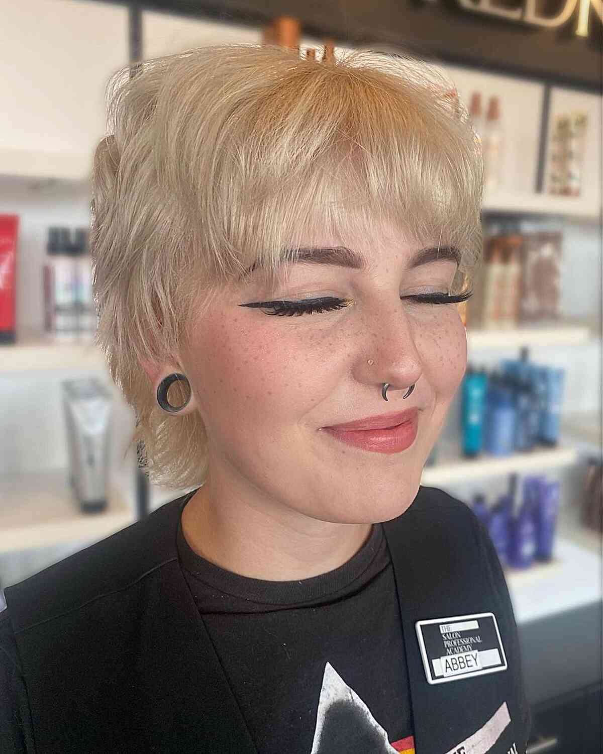 Soft Tousled Pixie Cut in Pale Blonde with Choppy Layers and Bangs