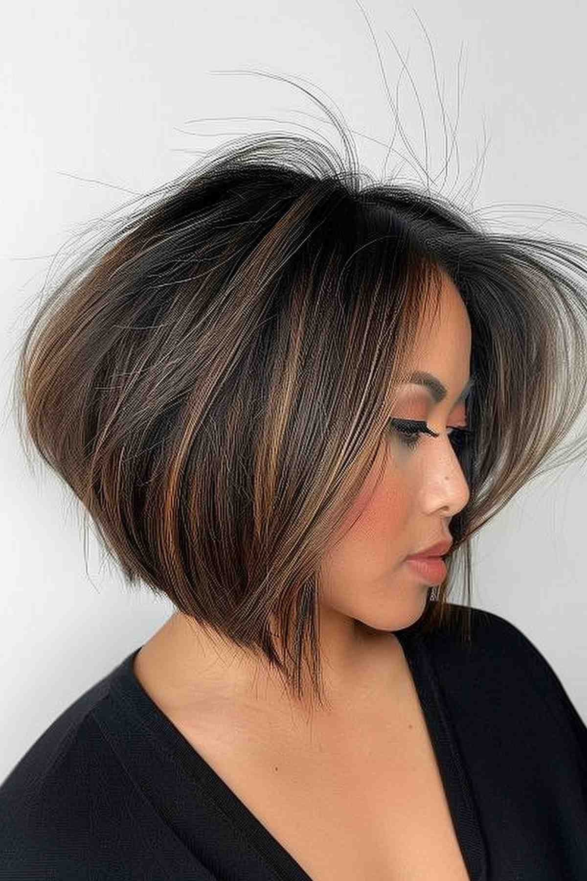 Chic woman with striking highlighted angled bob hairstyle