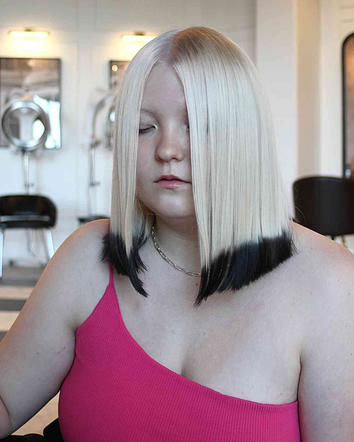 Striking White Blunt Bob Featuring Black Dip Dye Hair Color Inspiration