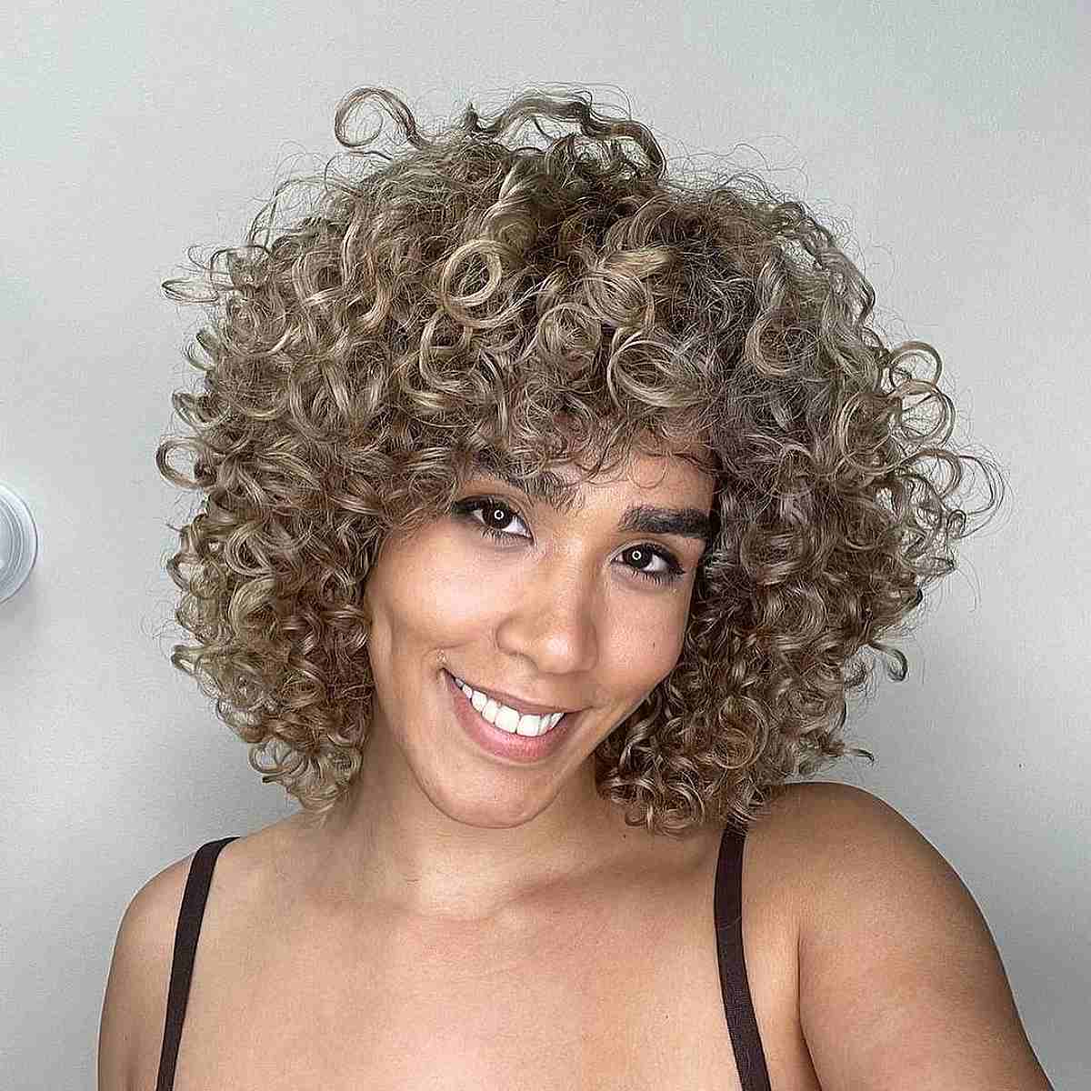 Stunning Blonde Curls with Bangs