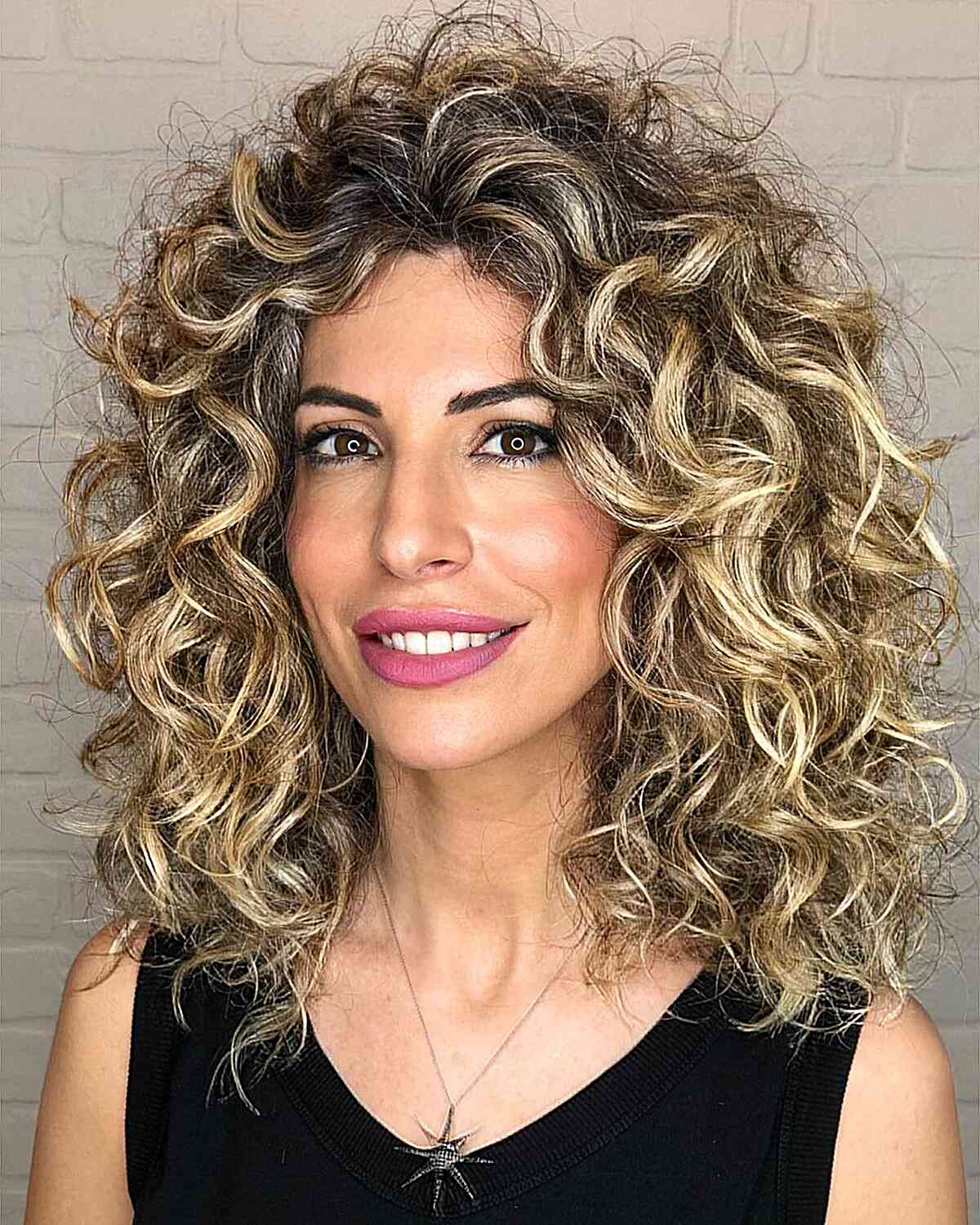 Stunning Dirty Blonde Balayage for Curls