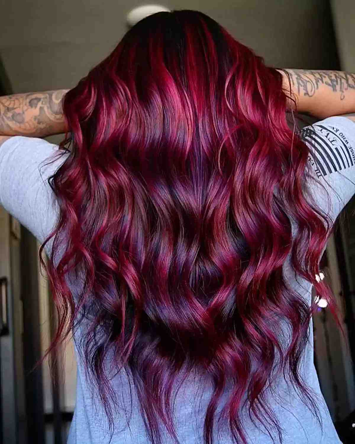 Stunning Red Balayage Highlights for ladies with long wavy black hair