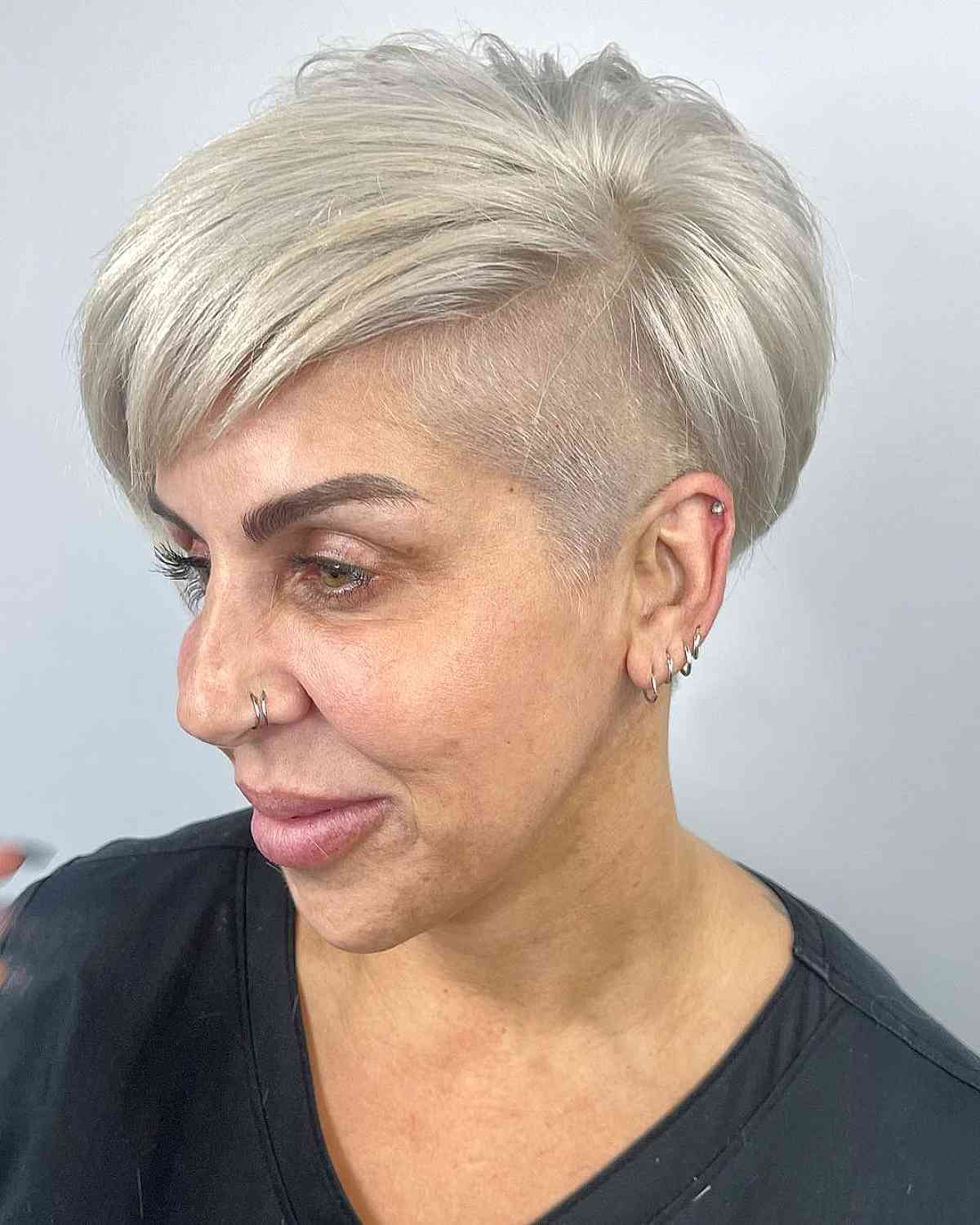 Stylish Bleached Blonde Pixie Undercut for Women Over 50