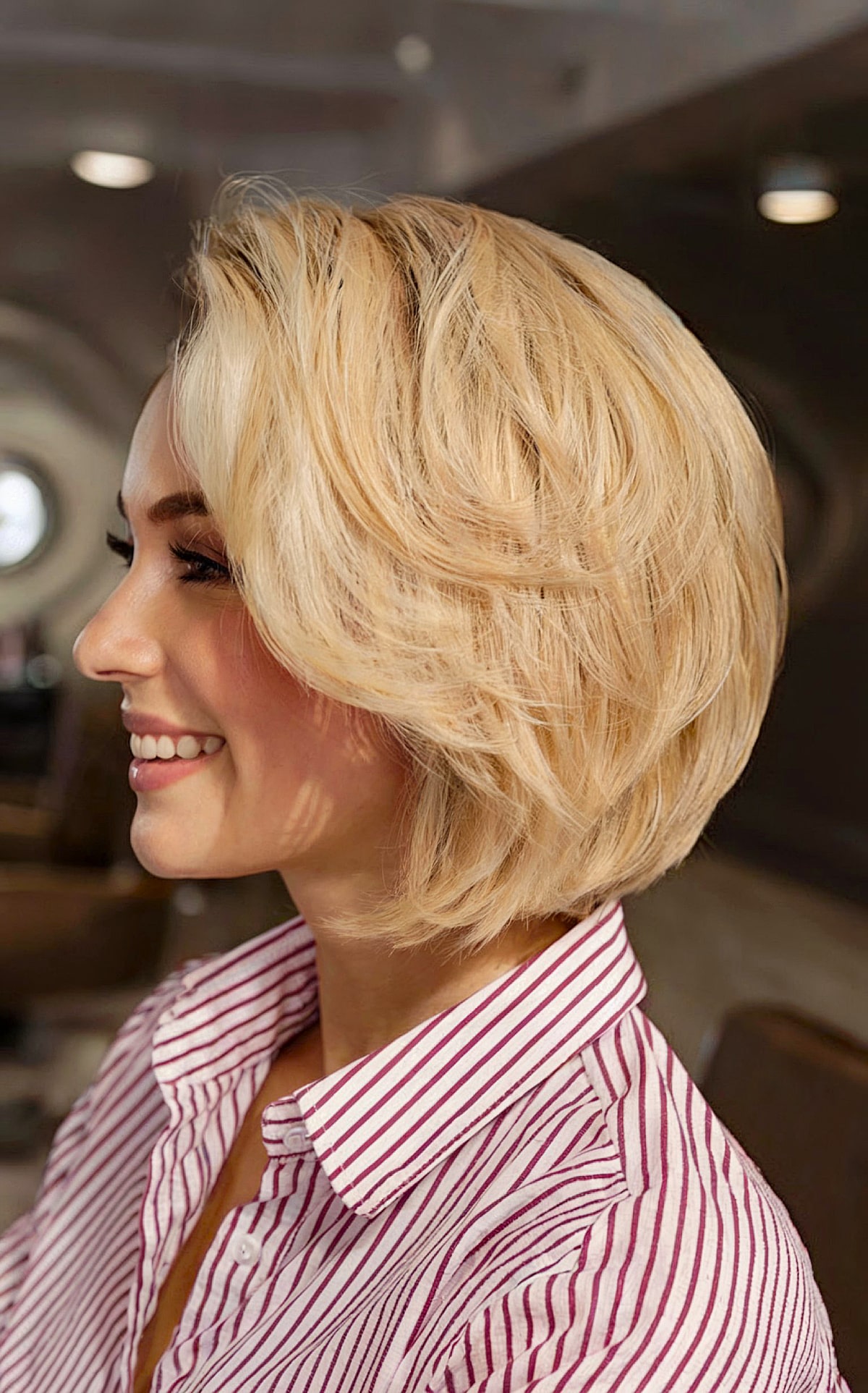 Neck-Length Bouncy Blonde Bob with Long Bangs