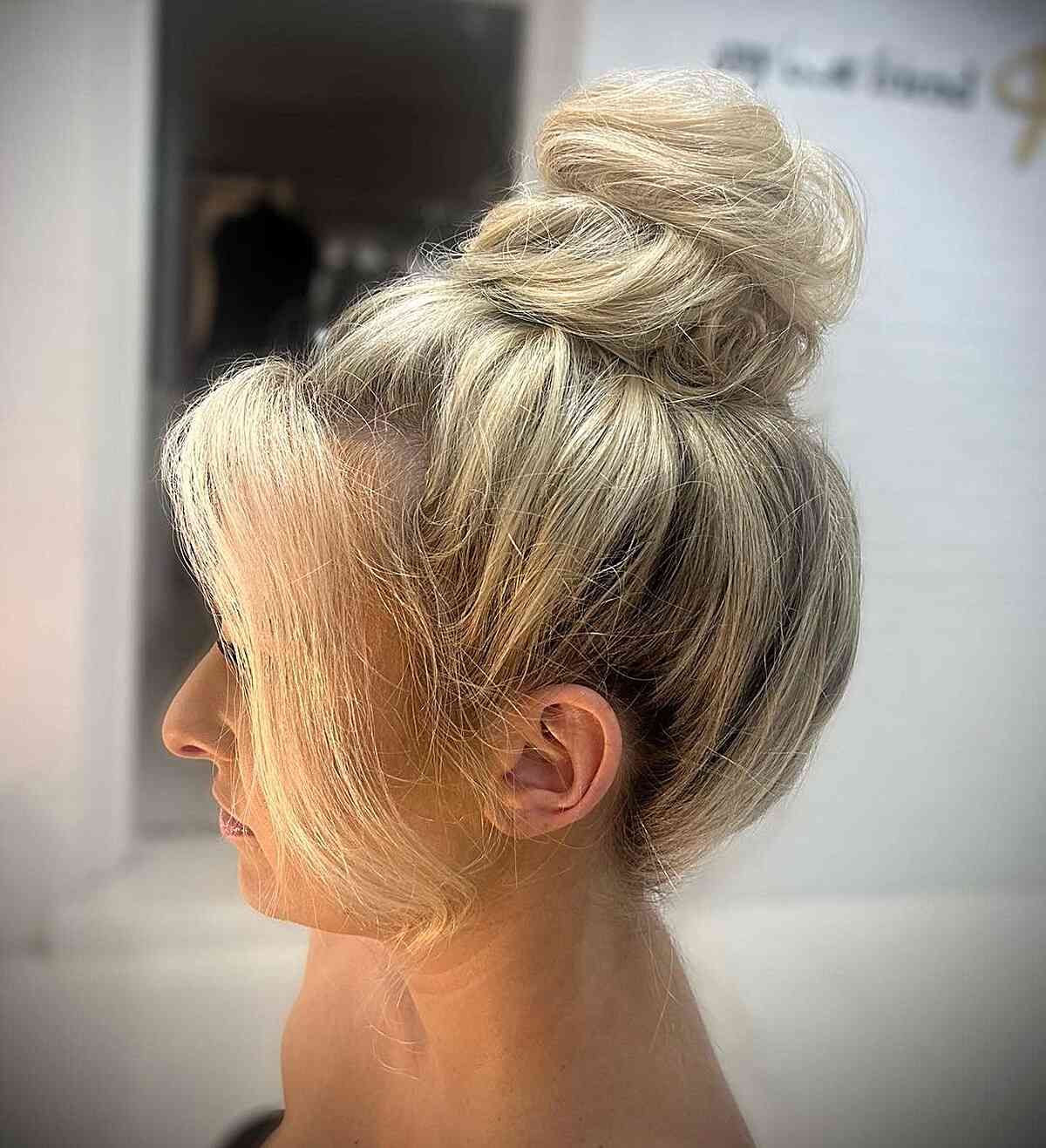 Chic Blonde Top Bun with Flowing Bangs for Hawaiians