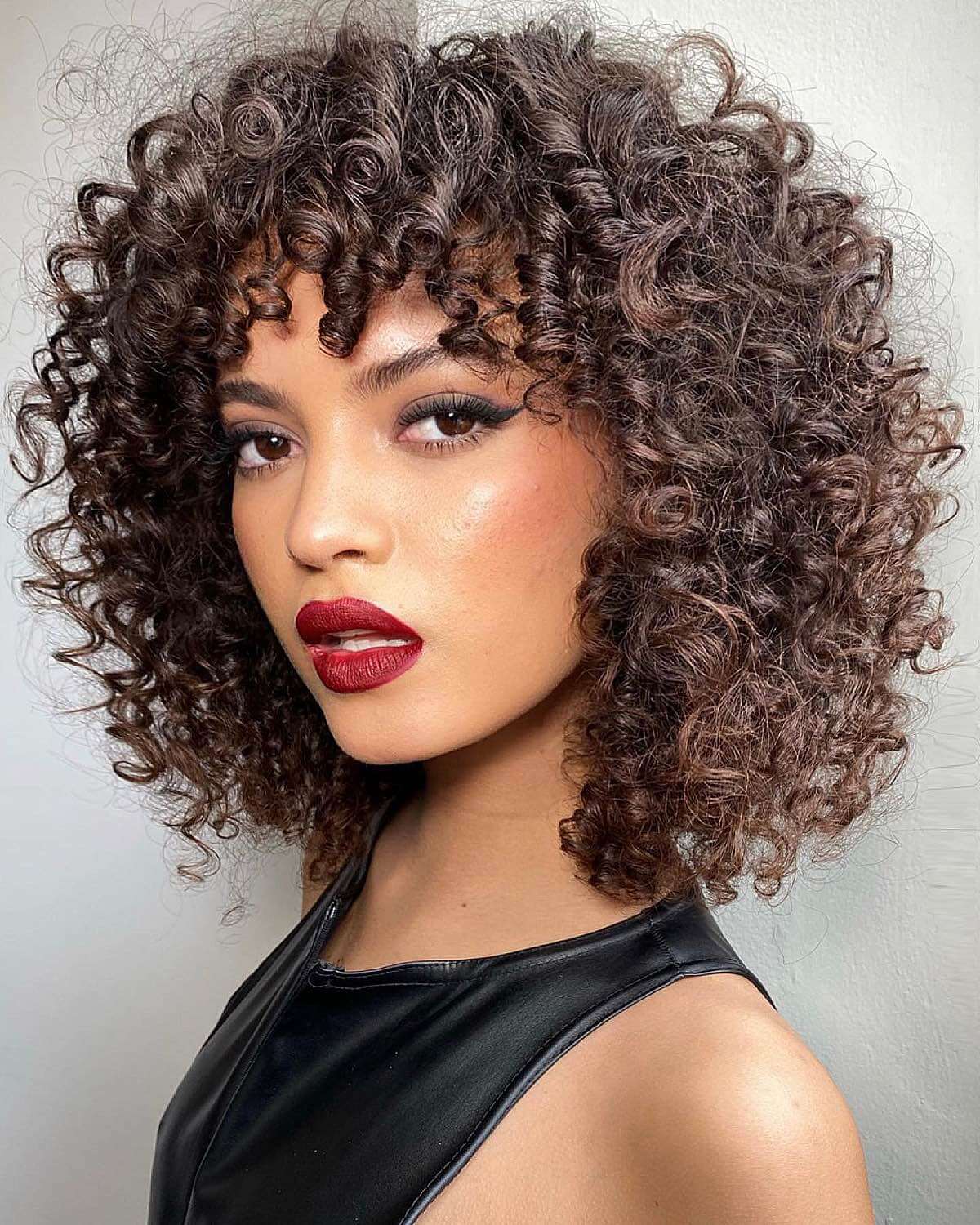 stylish curly short hair with bangs