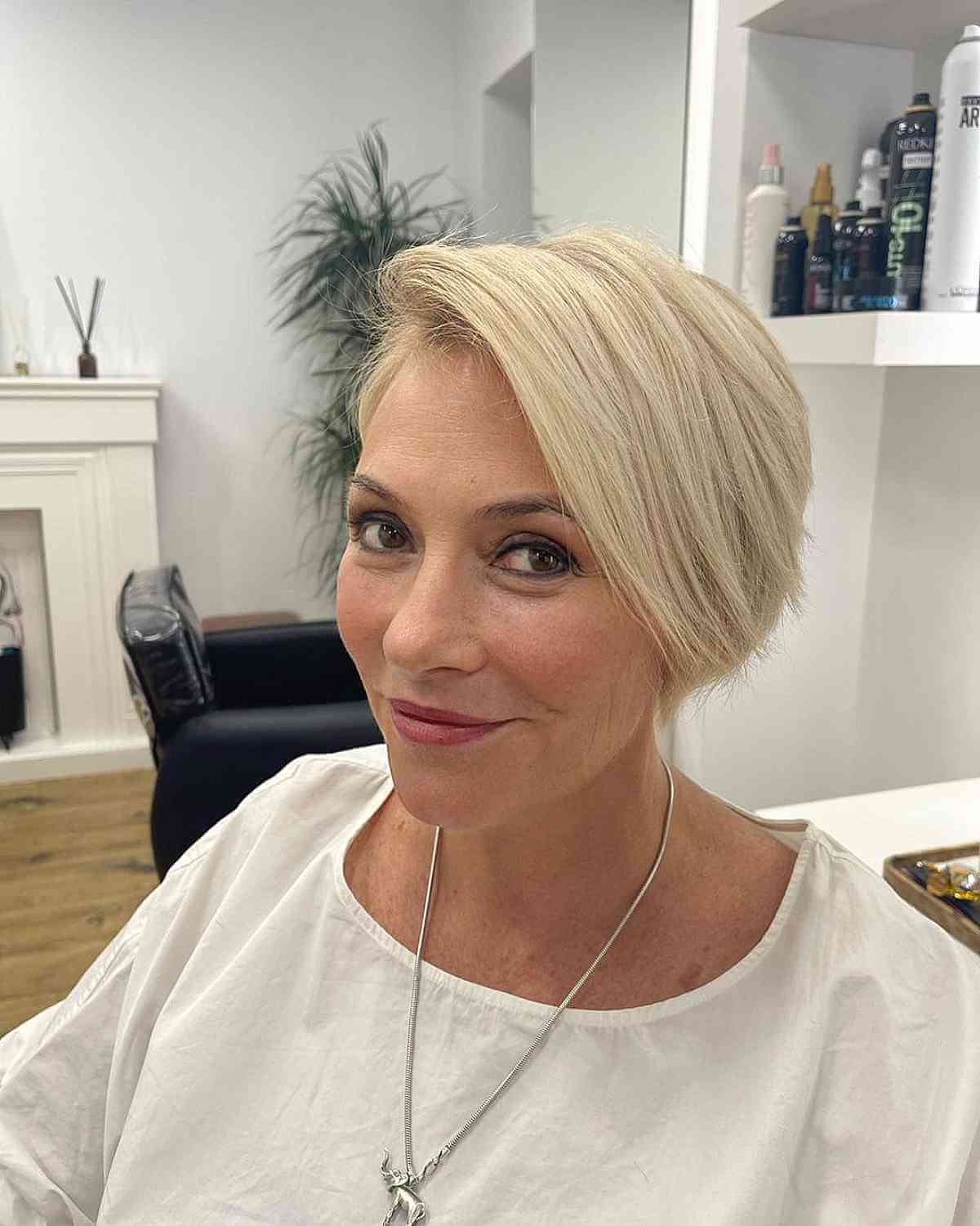 Stylish Extra Long Blonde Pixie with a Side Bang and Layers