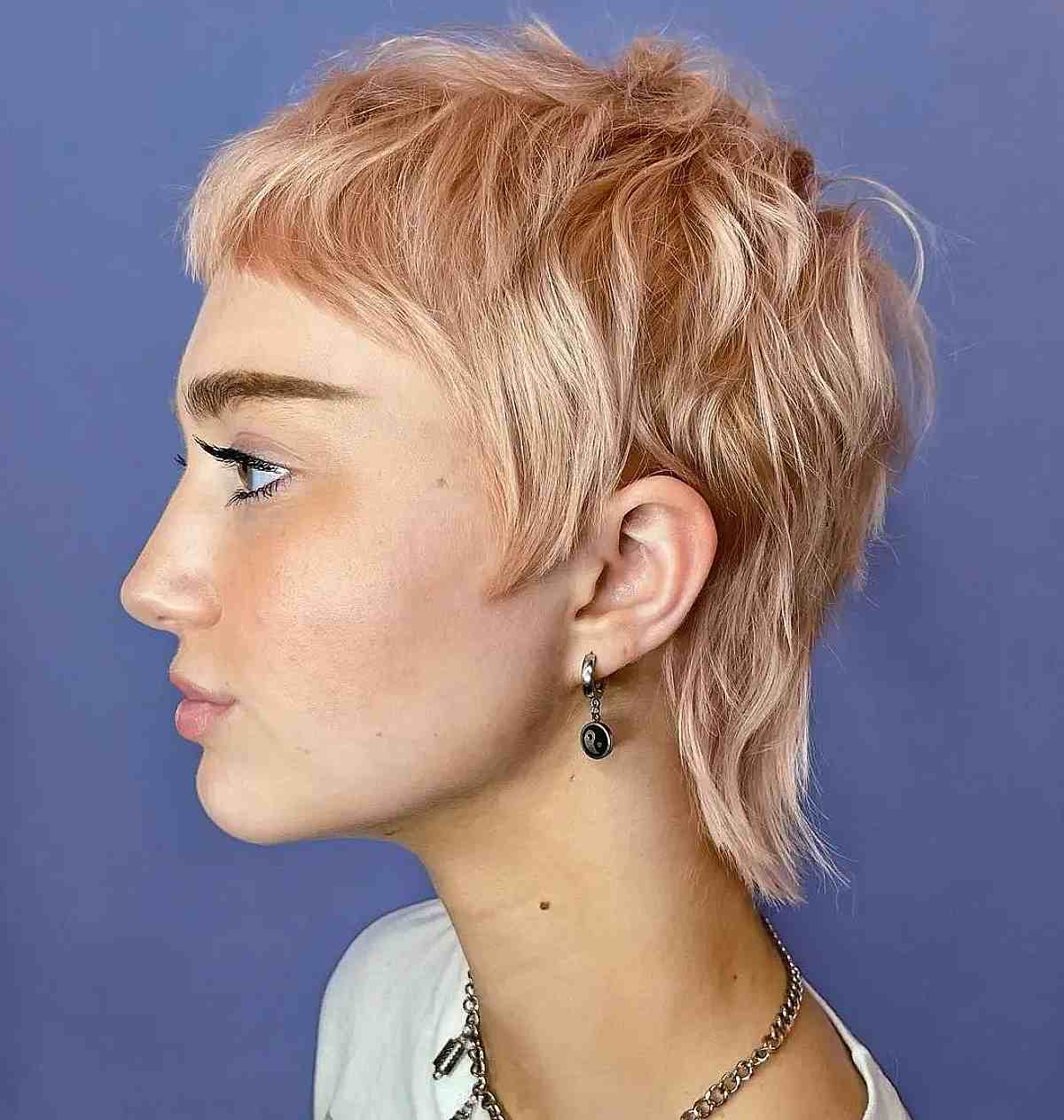 Stylish Golden Pink Pixie Hair with Playful Shagged Long Layers
