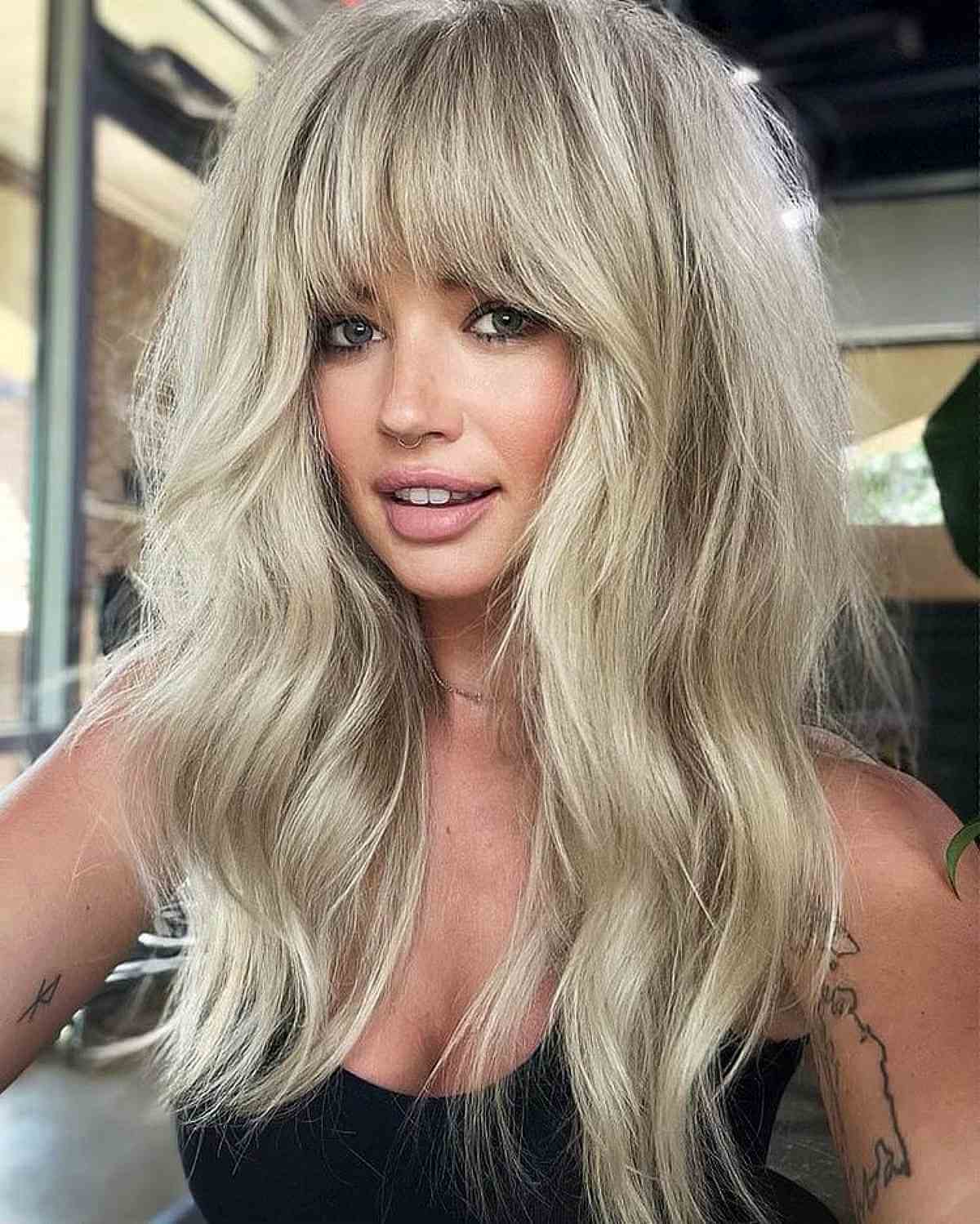 Stylish Long Blonde Shag with Bangs for Voluminous Hair