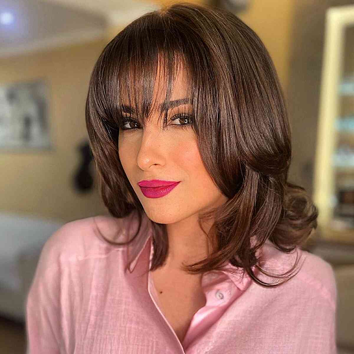 Stylish Long Bob with Soft Wispy Bangs and Layers for Mid-Length Hair