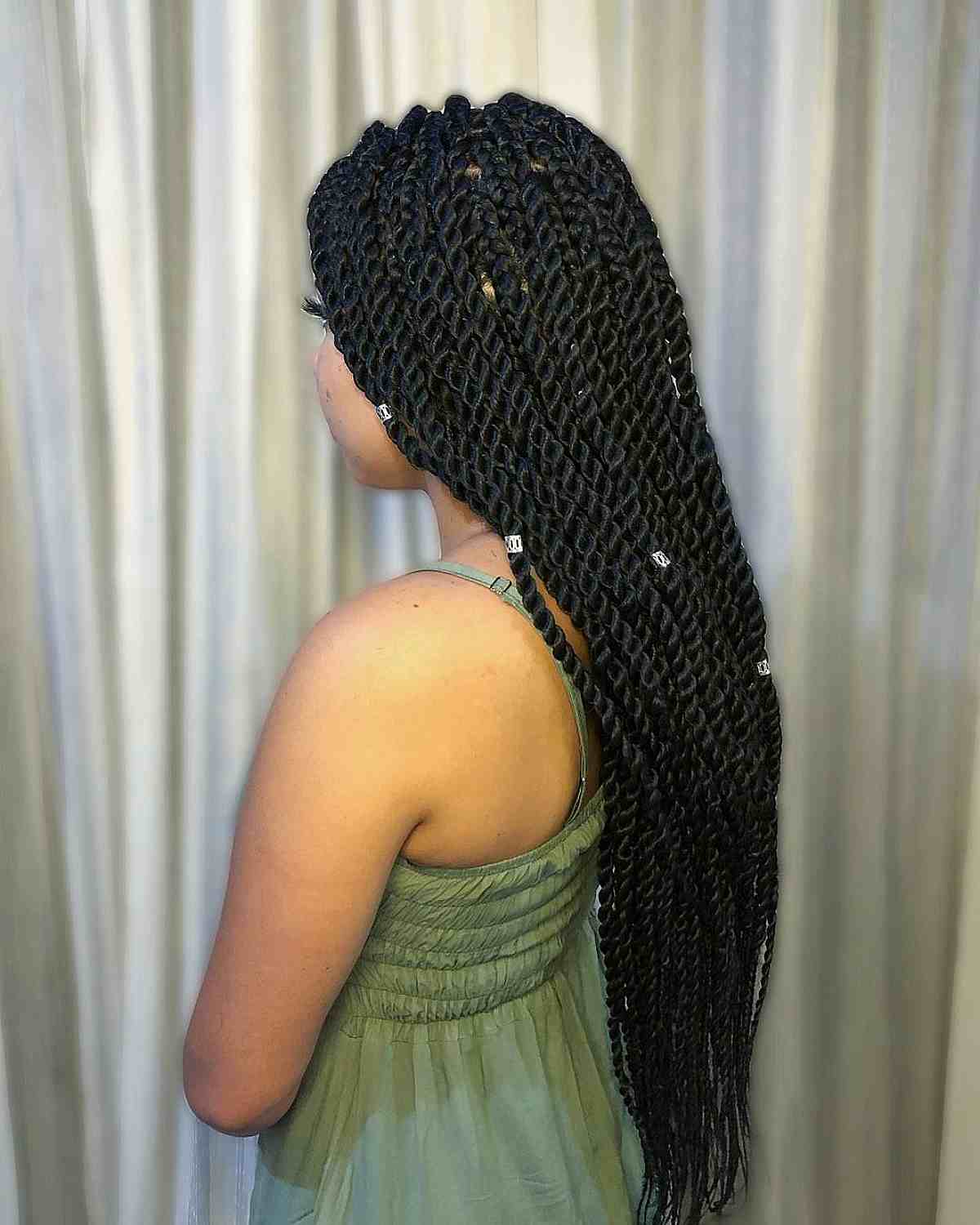 Stylish Long Twist Braids with Silver Cuffs