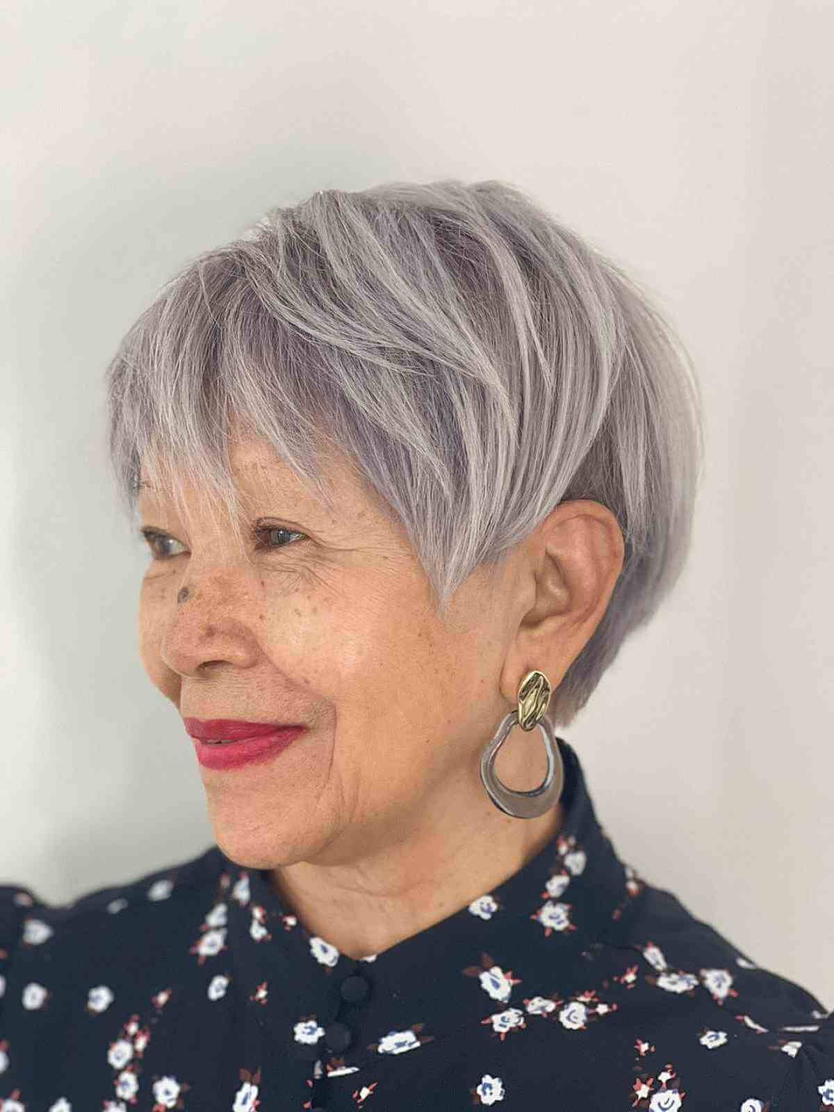 Stylish Long Pixie Cut with Extended Bangs for Grey-Haired 60-Year-Olds