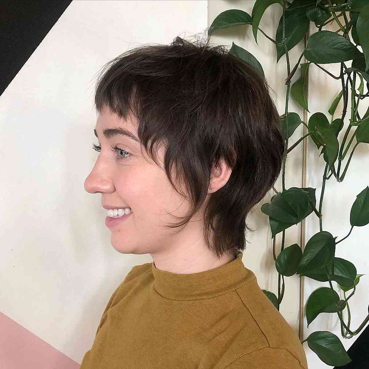 Trendy Long Pixie with Textured Bangs and Face-Enhancing Layers