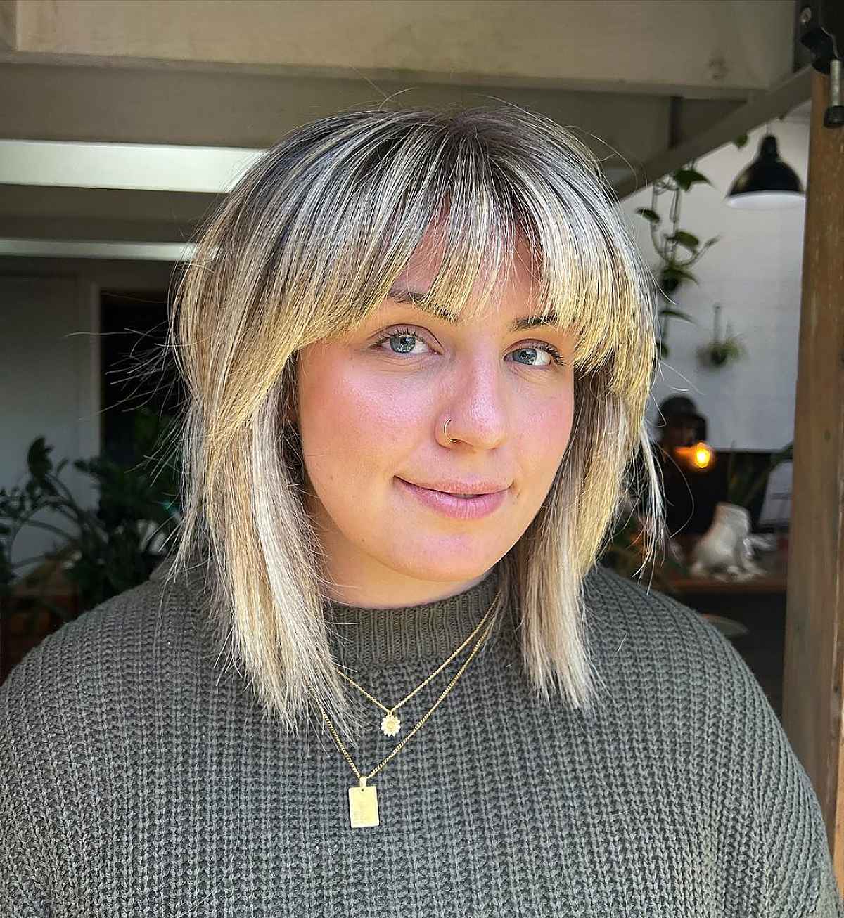 Stylish Long Shaggy Bob with Flattering Arched Bangs