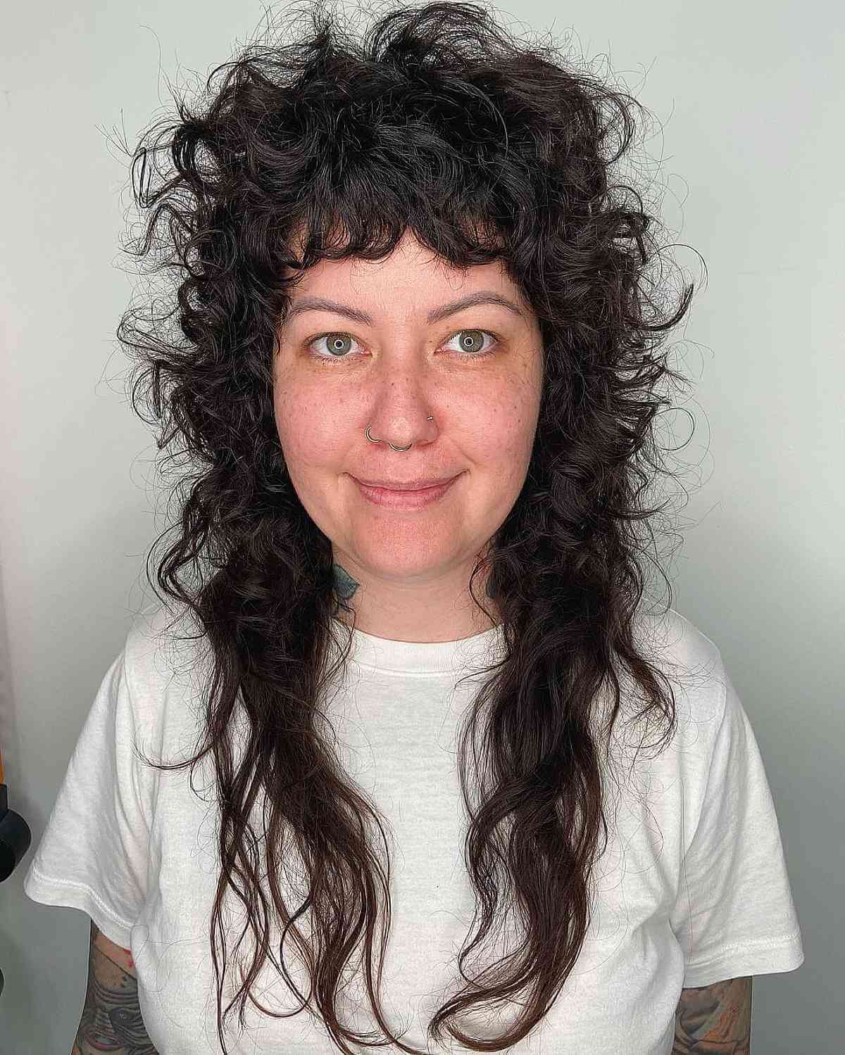 Stylish Long Shaggy Mullet with Textured Layers for Curly-Haired Women