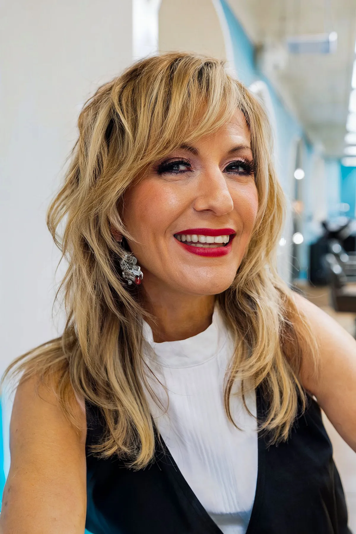 Stylish Medium-Length Blonde Wolf Cut Waves with Edgy Fringe
