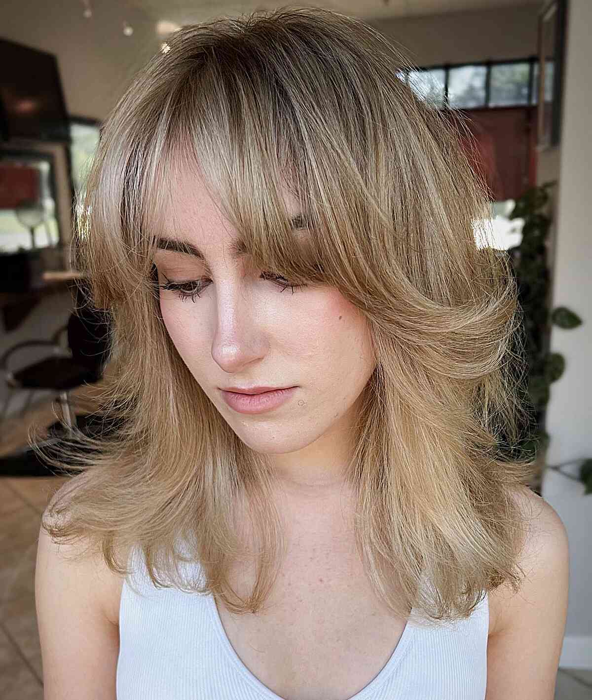 Medium Tousled Shag Lob Featuring Delicate Layers and Feathered Bangs