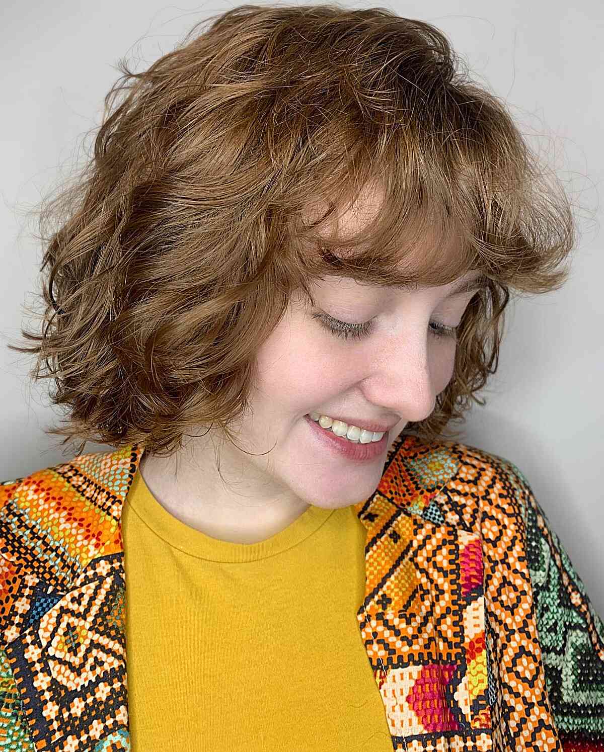 Stylish Short Hair Featuring Tousled Waves and Bangs