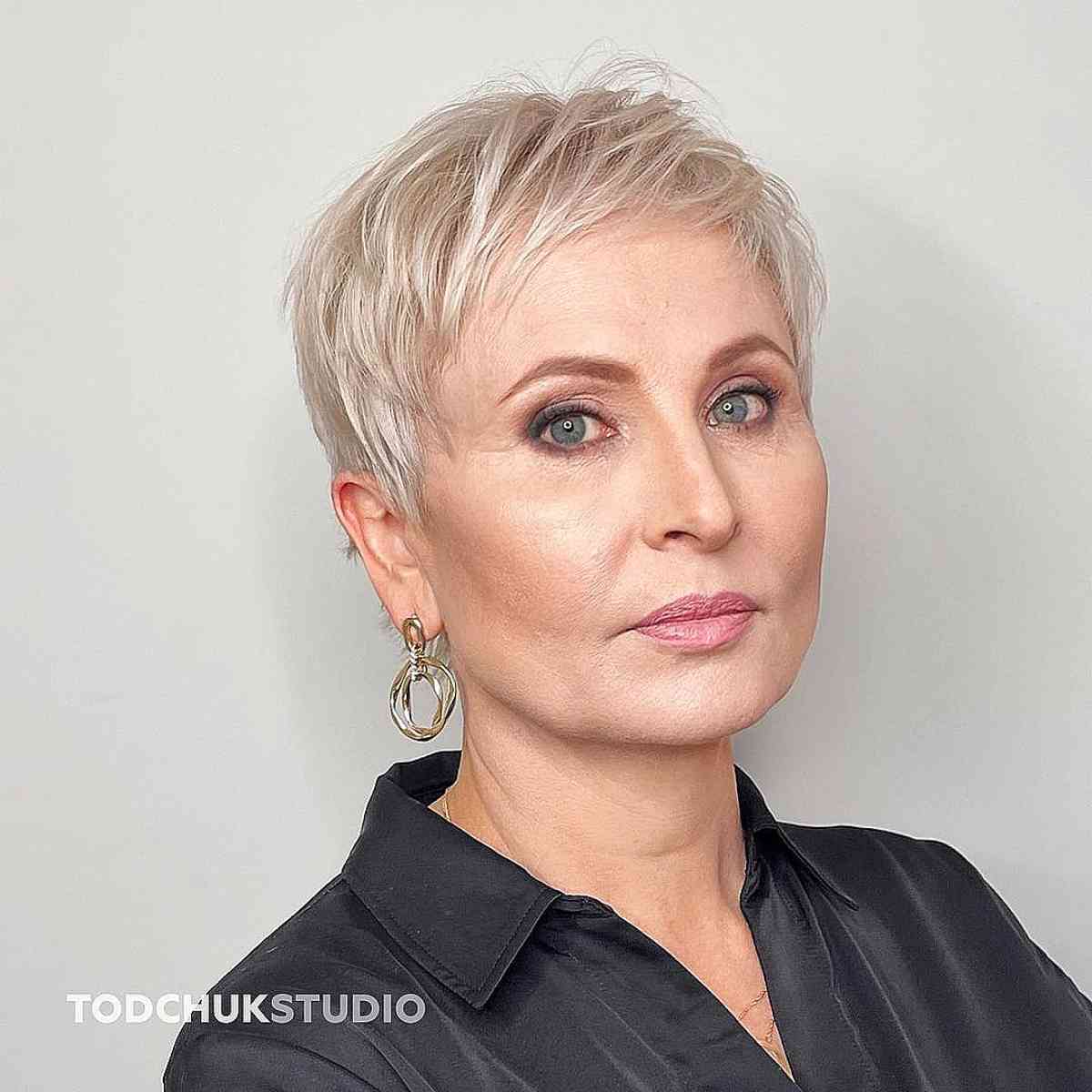 Stylish short haircut for women over 50 with round faces
