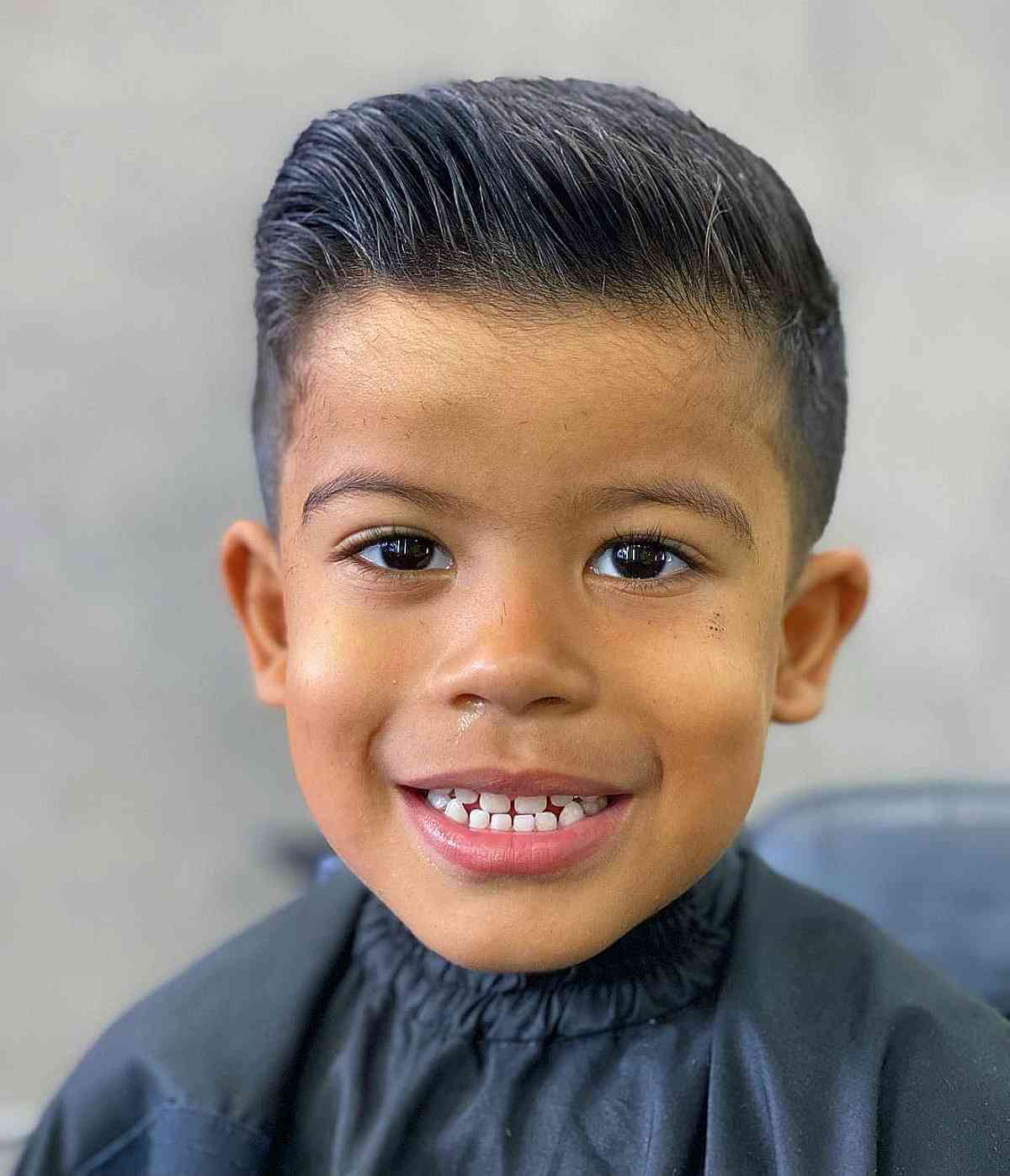 Stylish Short Slicked Back Hairdo for Young Boys