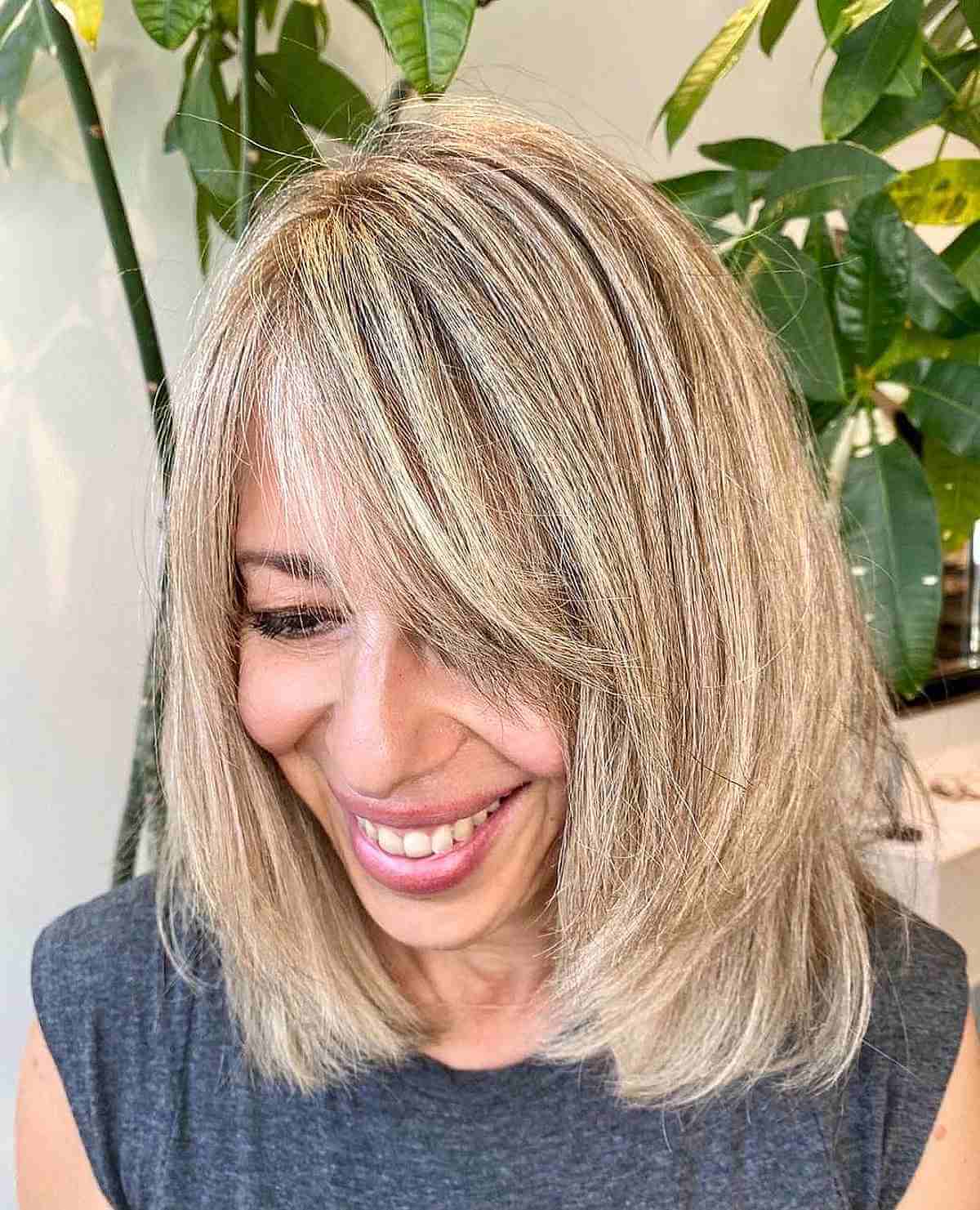 Chic Shoulder-Length Cut with Side Bangs with Layers for Women Over 40