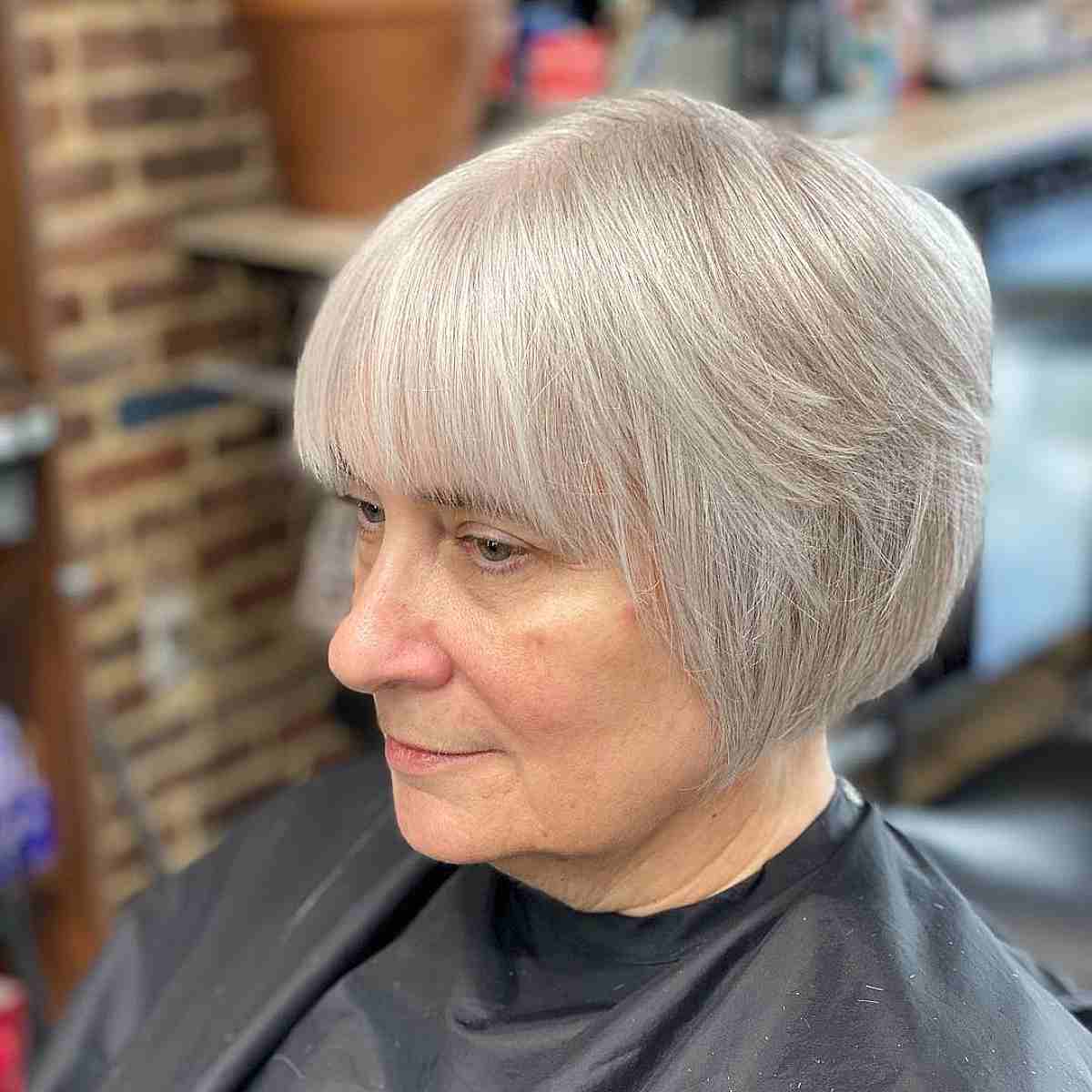 Stylish Tapered Bob Haircut on Grey Hair at the Jawline