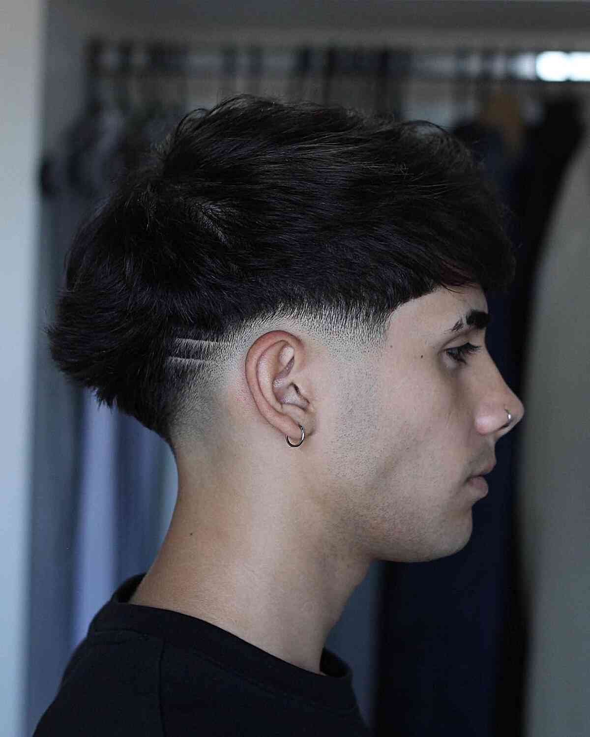 Subtle Low Taper with Creative Shaved Designs on Men with Thick Hair