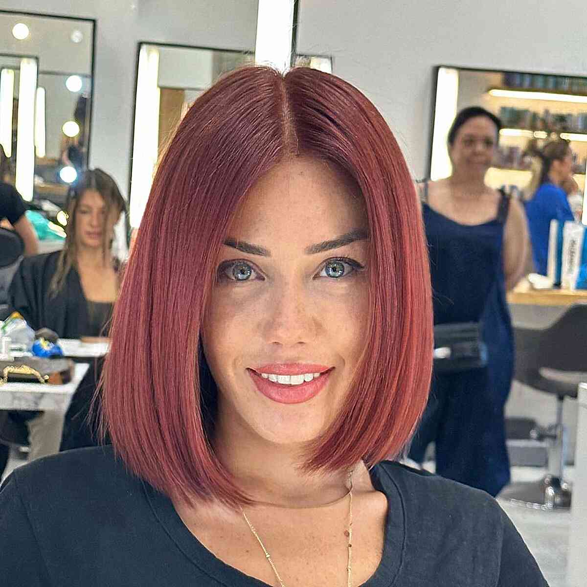 Subtle Red Center-Part Blunt Bob