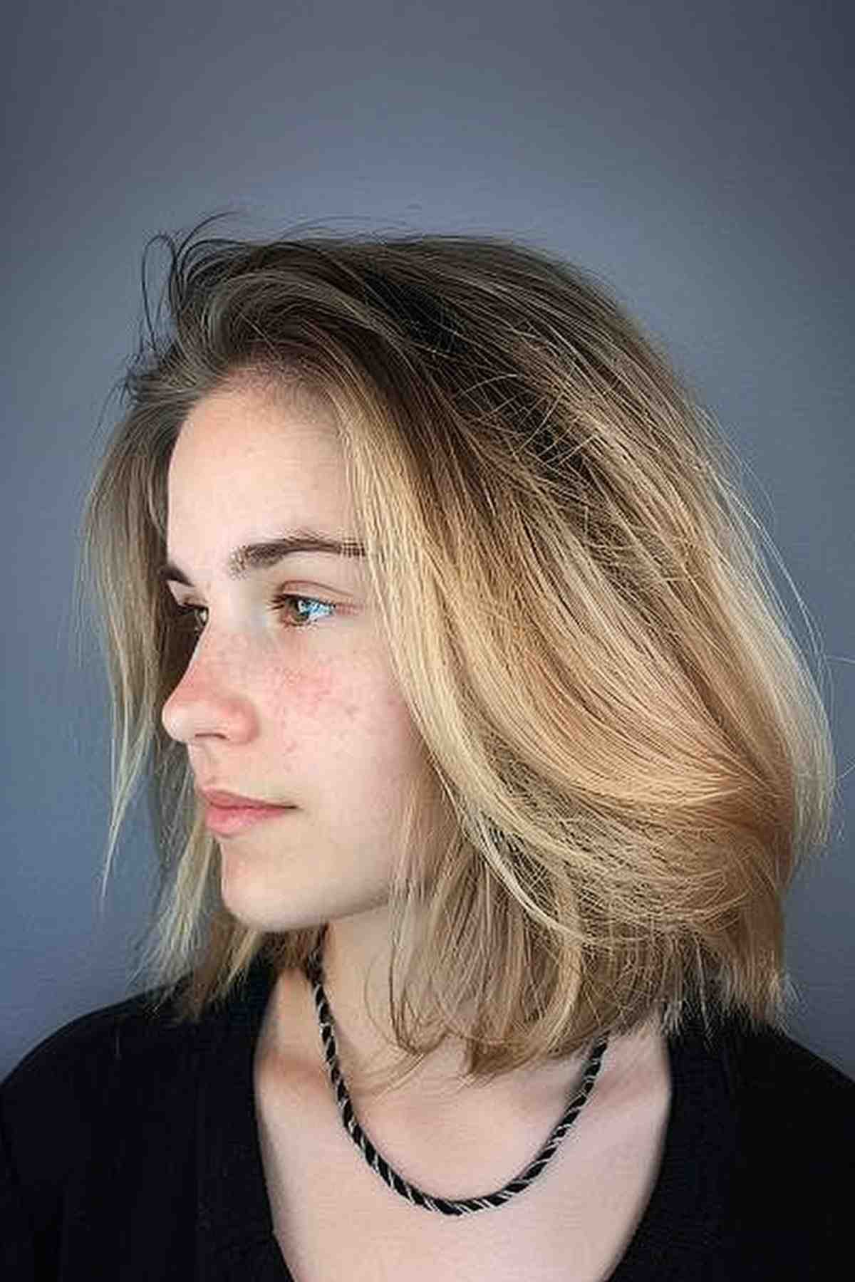 Textured Layered Haircut with Dark Roots and Blonde Tips