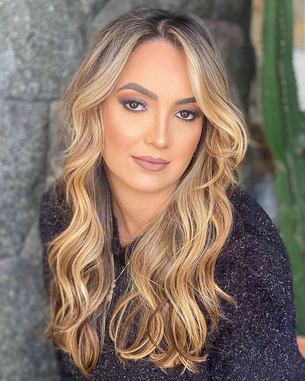 Stylish Blonde Balayage with Face-Framing Layers on Wavy Hair
