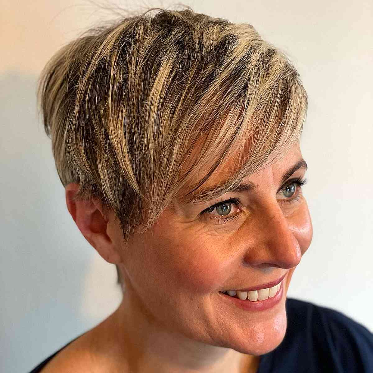 Sun-Kissed Blonde Highlights on a Razor Cut Pixie