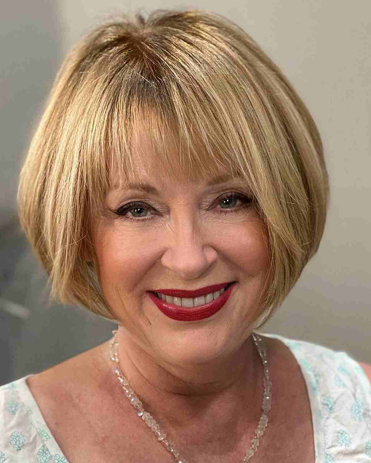 Sunlit Blonde Rounded Bob with Wispy Fringe