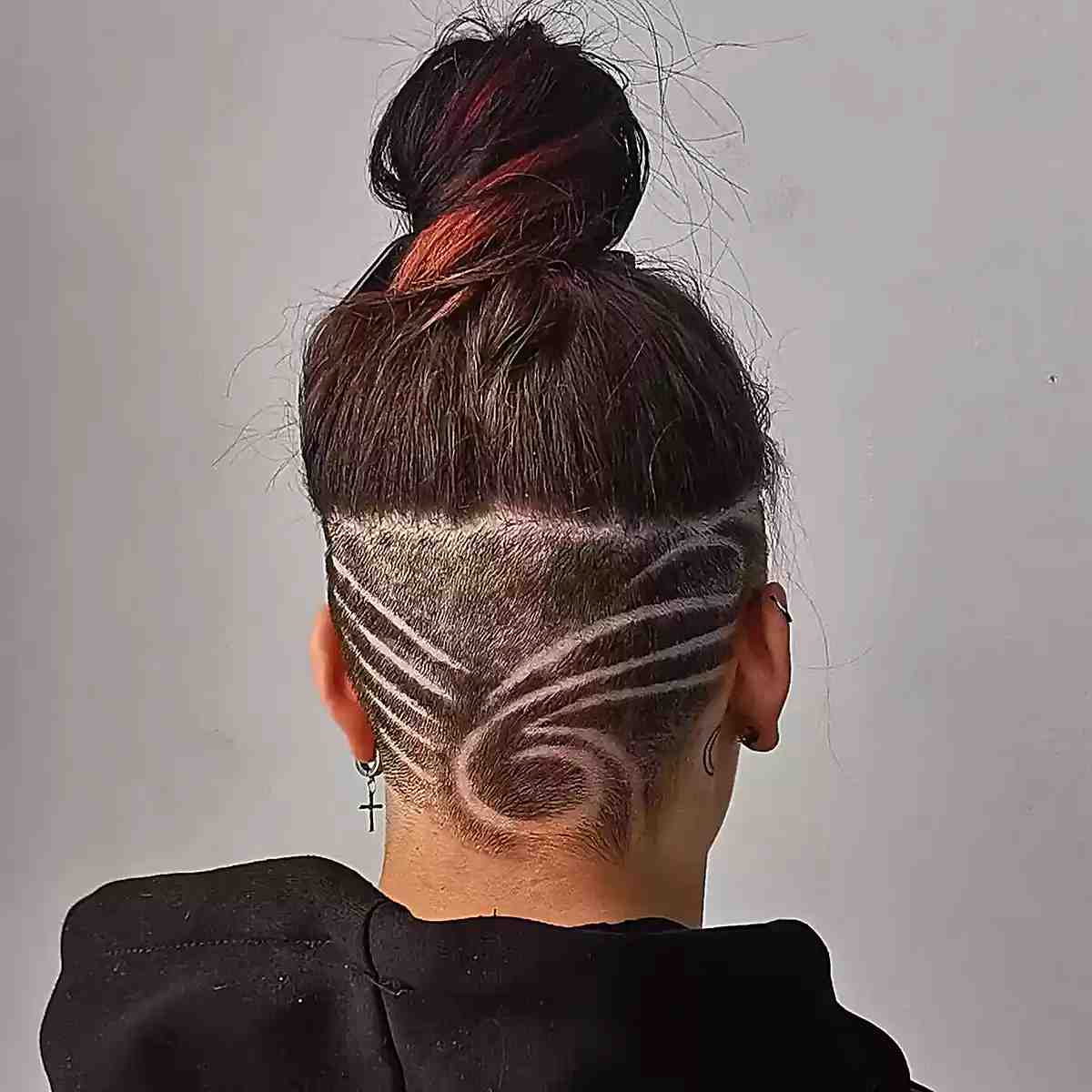 Tattooed undercut featuring shoulder length hair