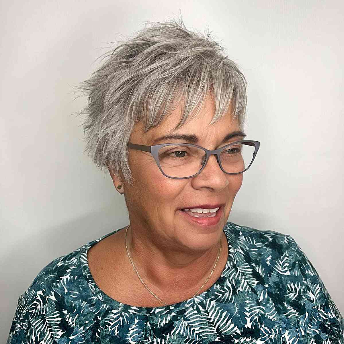 Textured and Spiky Pixie Hairstyle for Older Women with Glasses
